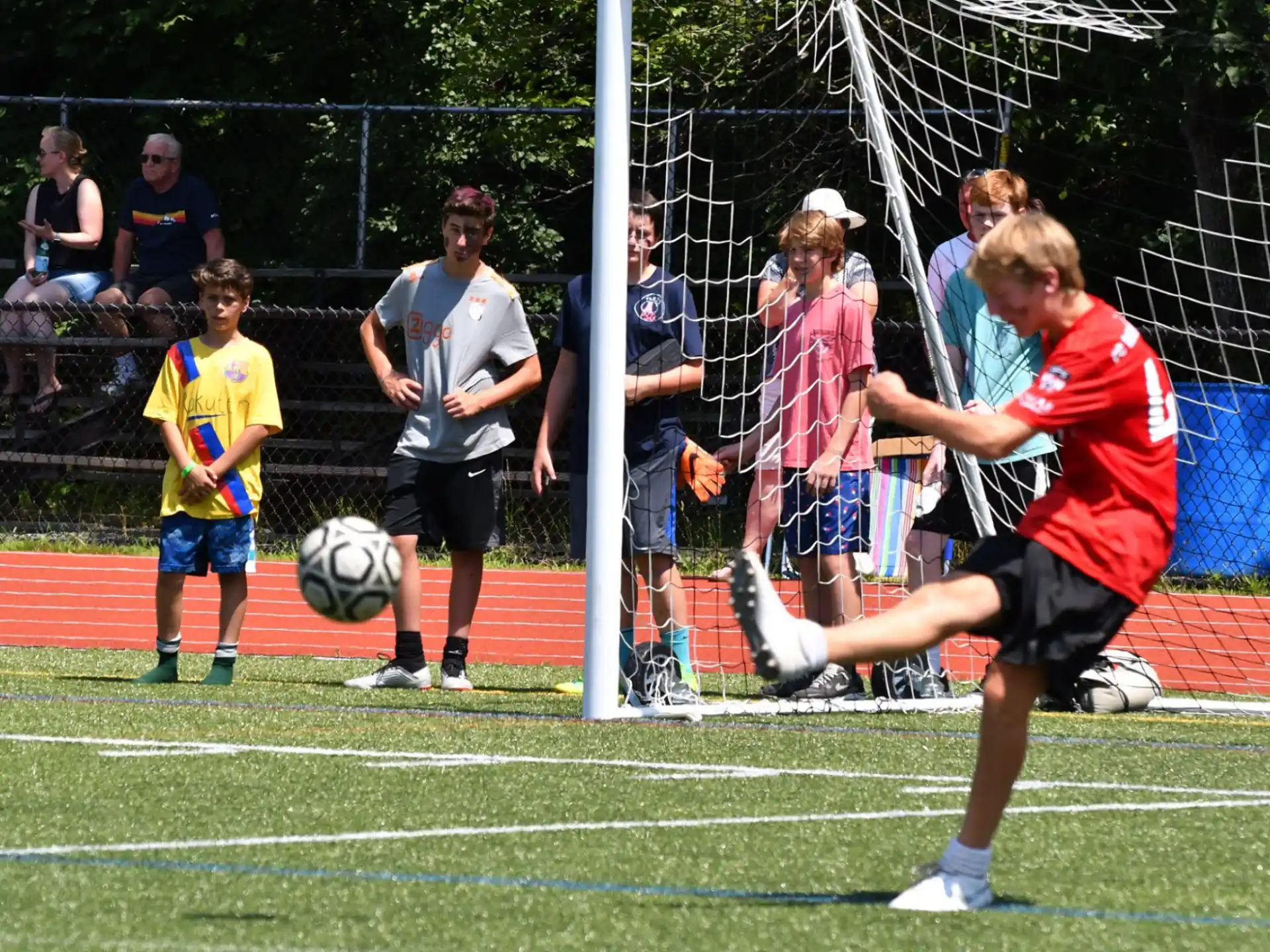 a group of kids playing football