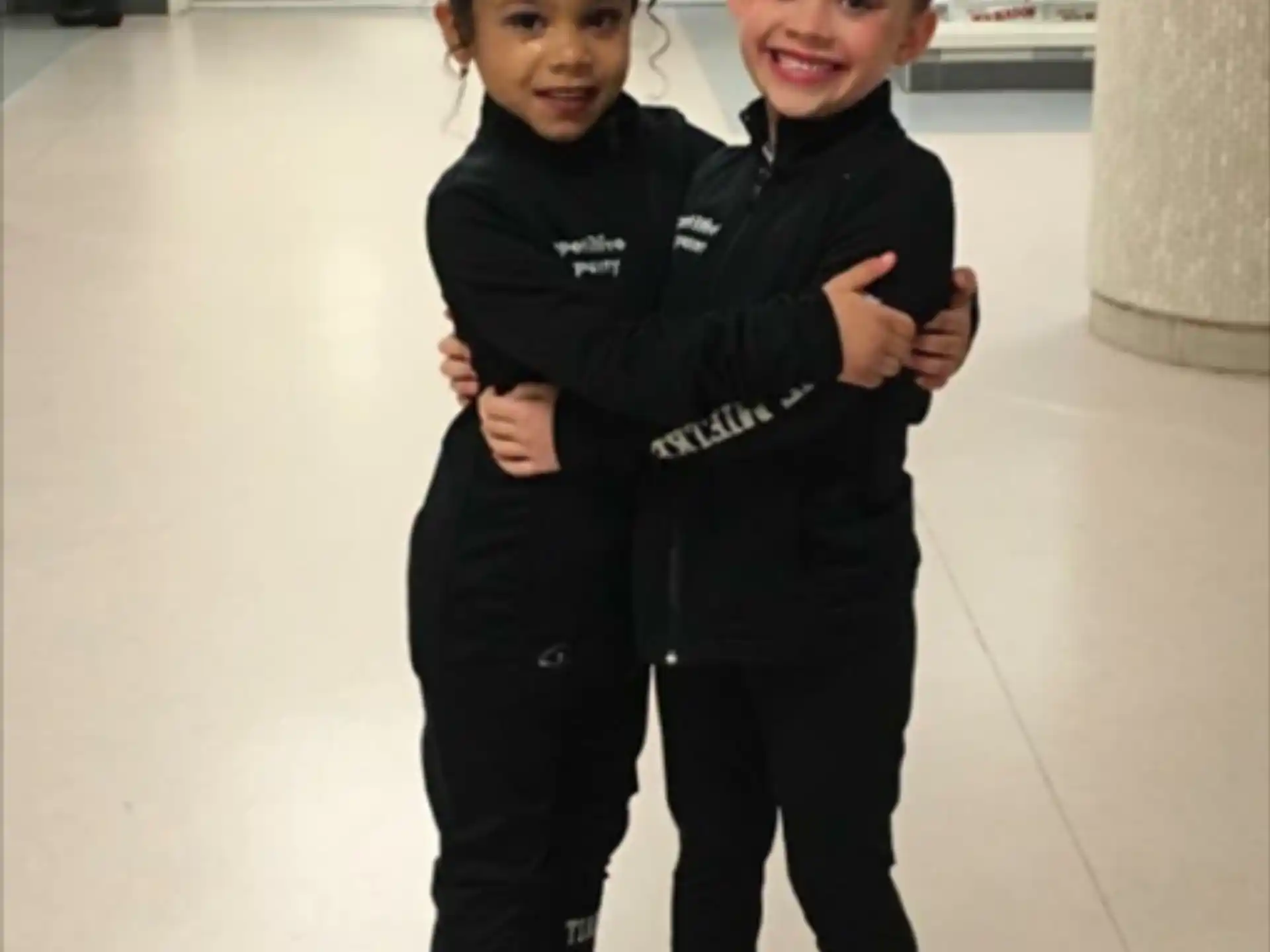 a couple of children hugging
