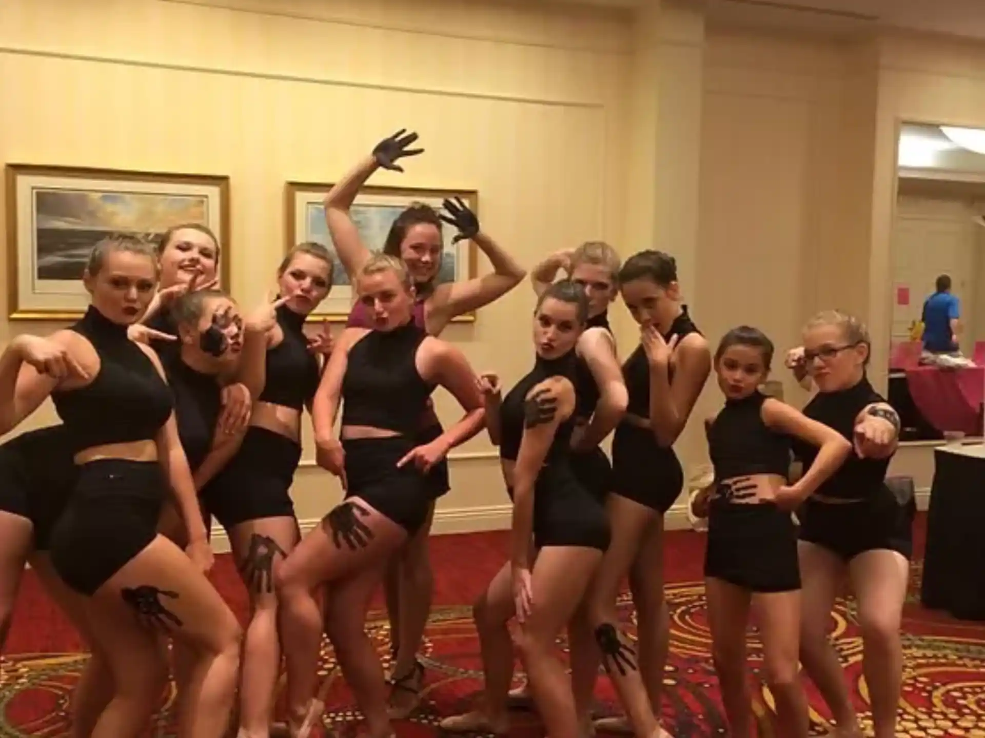 a group of women in black dancing