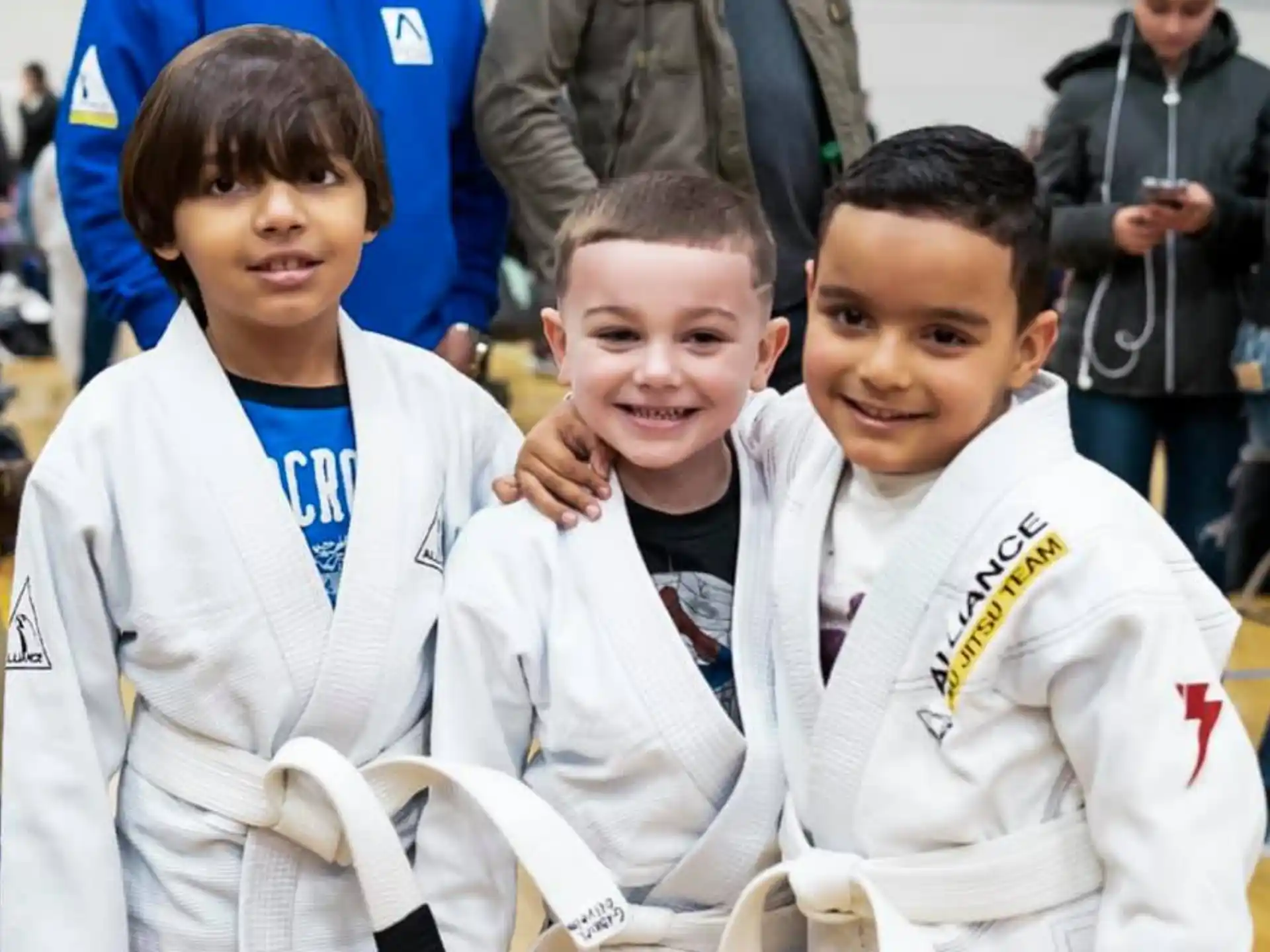 a group of boys in white uniforms