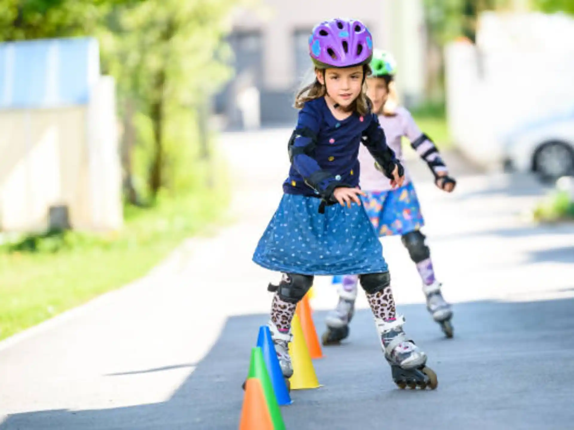 a couple of girls rollerblading