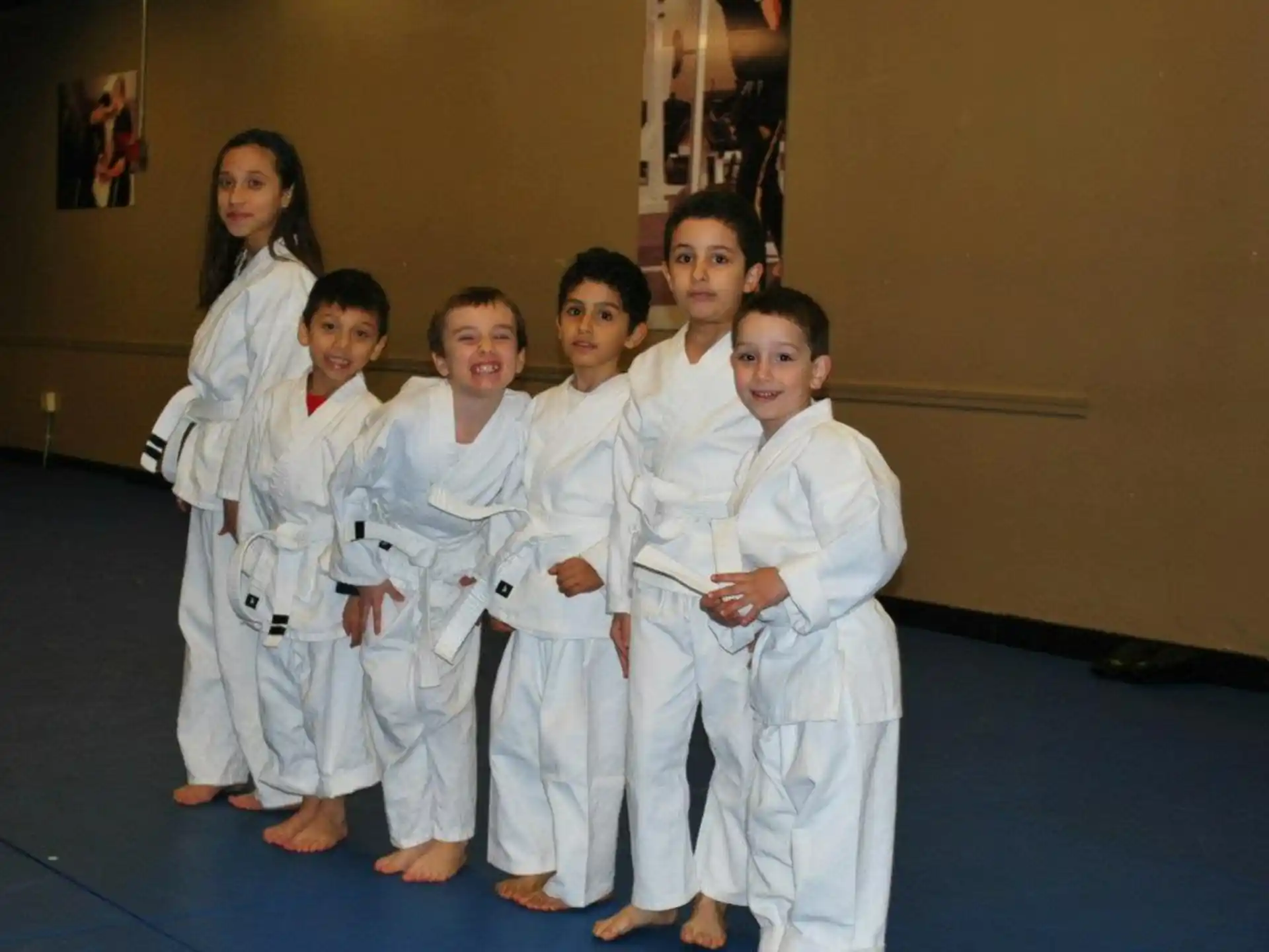 a group of people wearing white karate uniforms