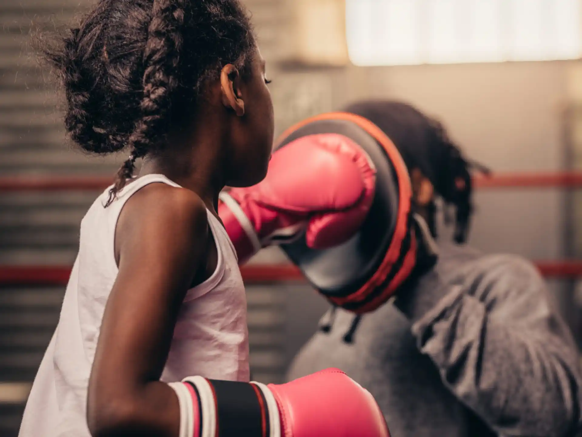 a man and woman wearing boxing gloves