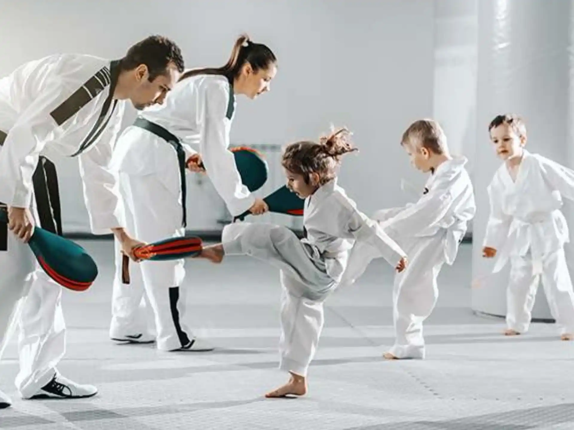 a group of people in karate uniforms