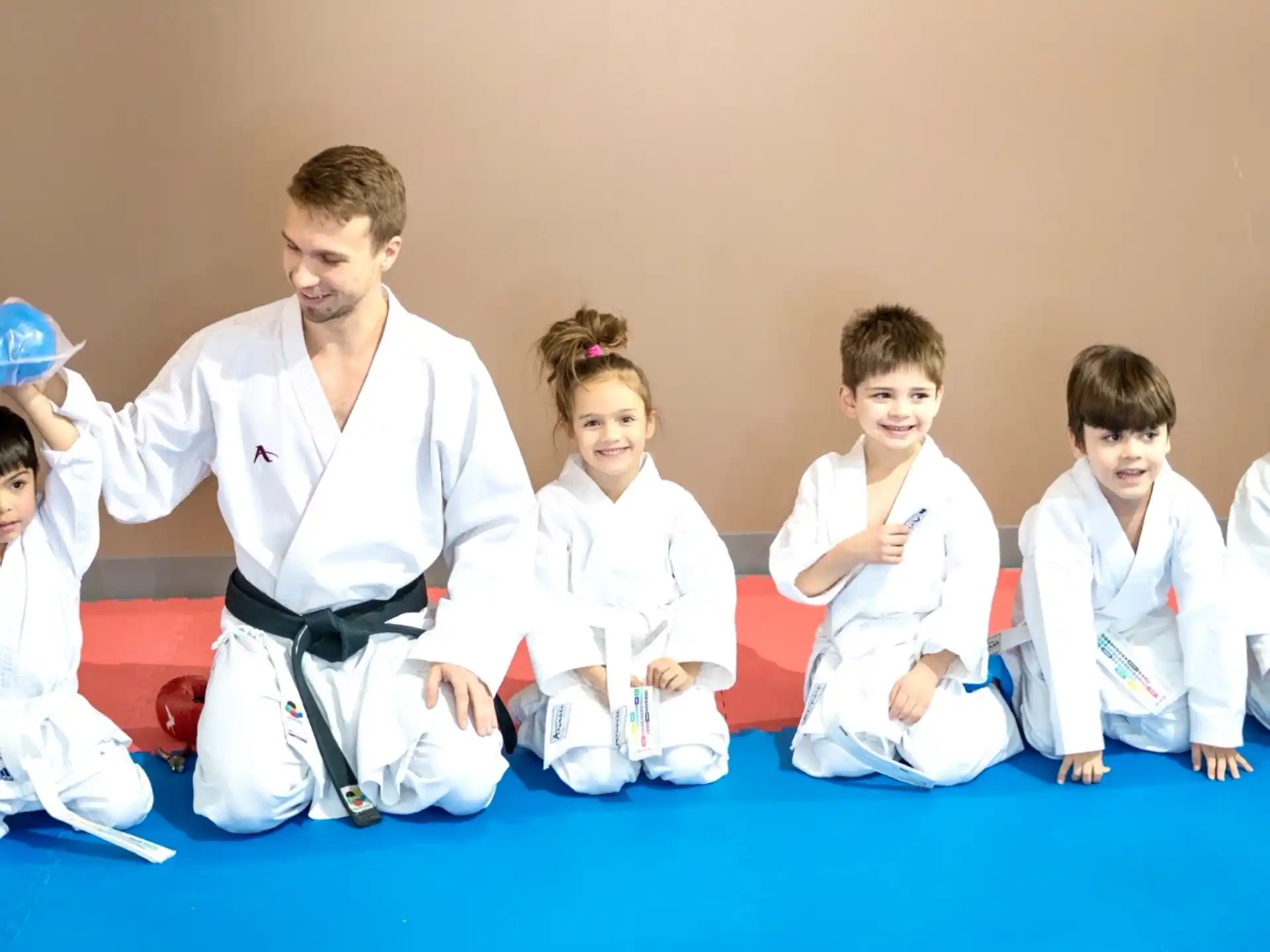 a group of people in karate uniforms