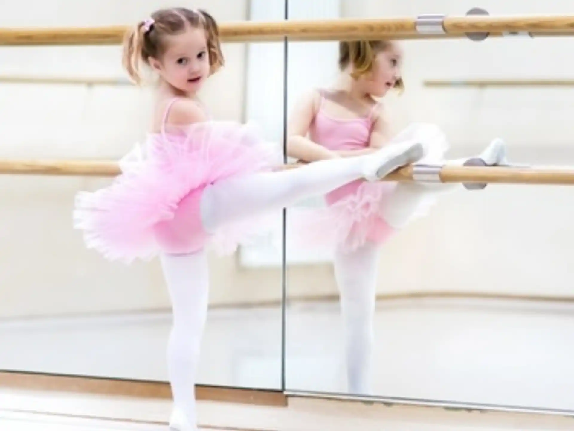 two girls in pink dresses