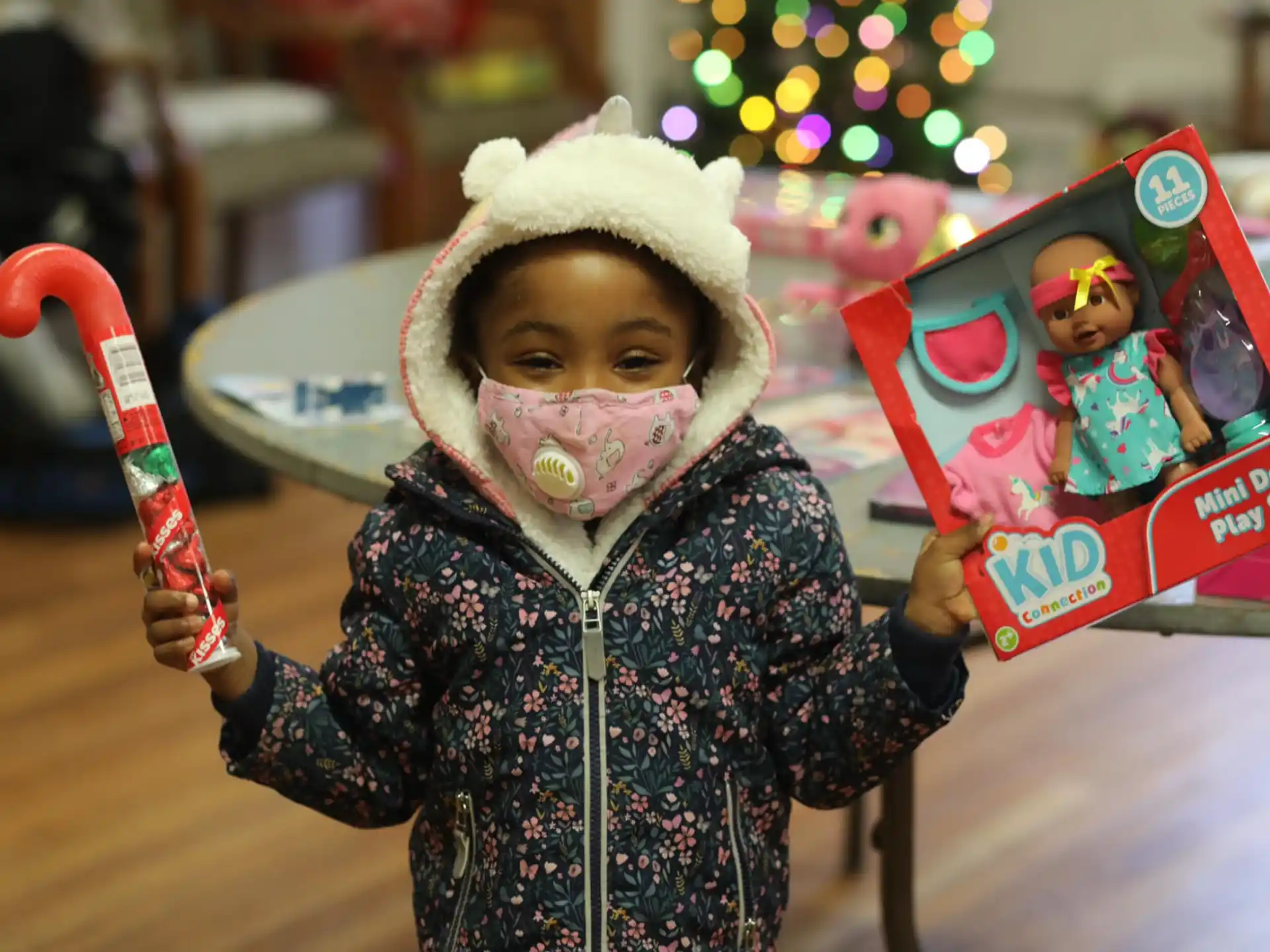 a doll with a hat and a toothbrush