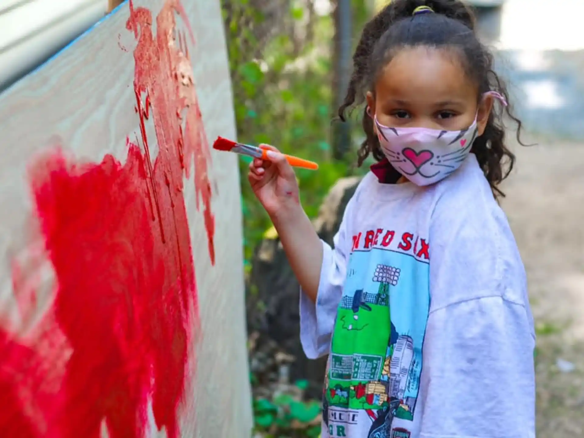 a little girl painting
