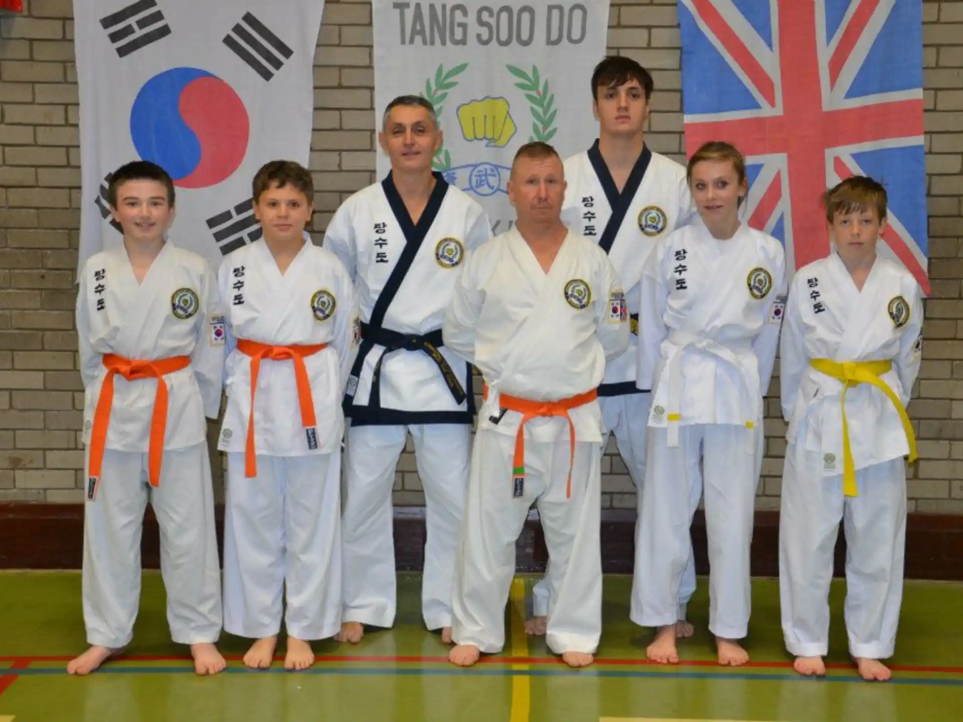 a group of people in karate uniforms