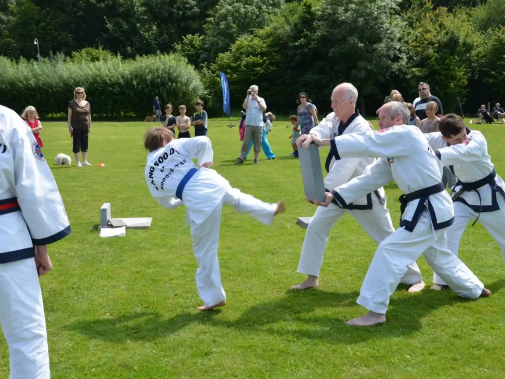 a group of people in karate uniforms