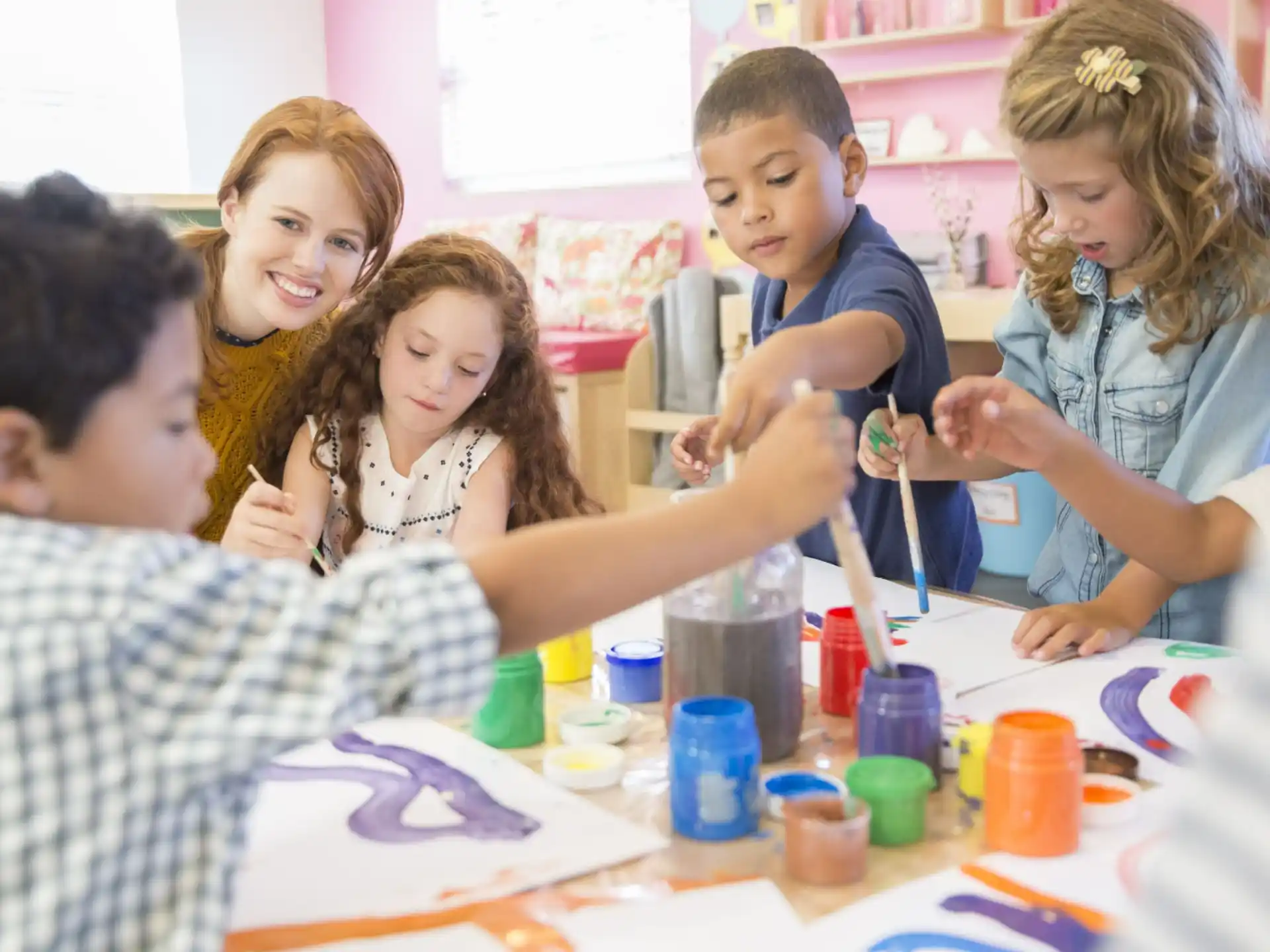 a group of people painting