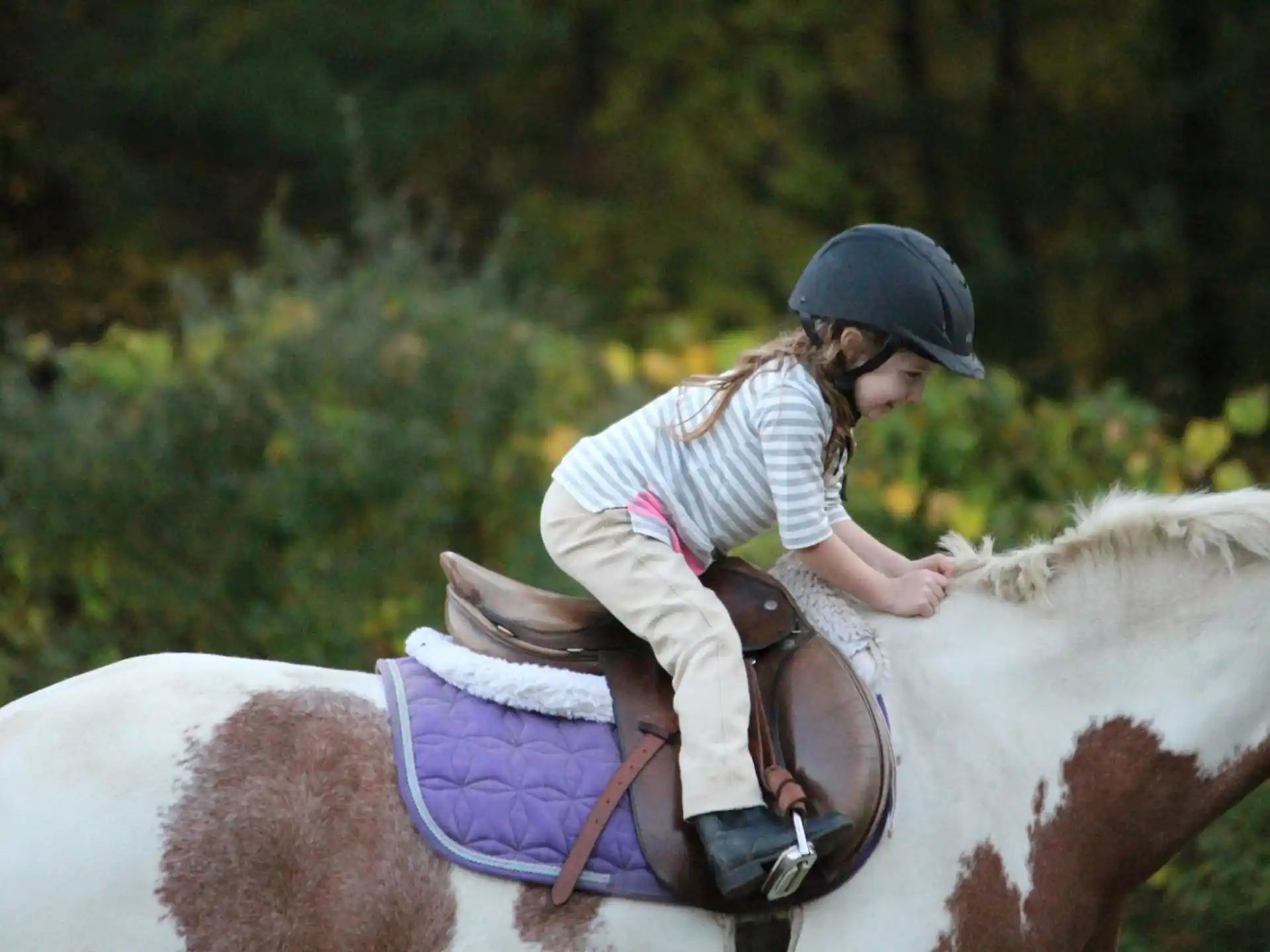 a girl riding a horse