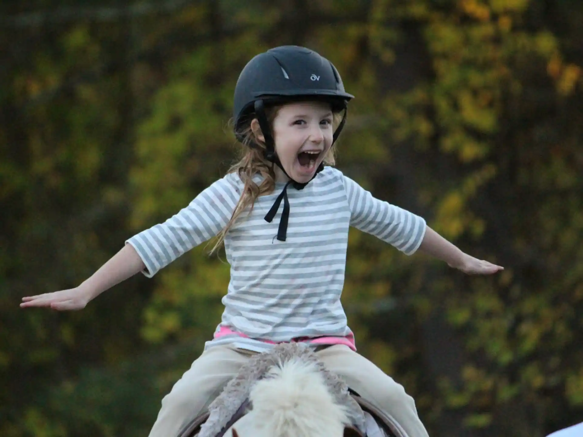 a girl riding a horse