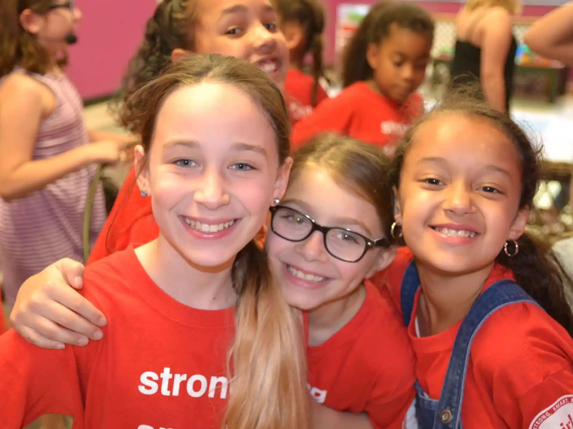 a group of girls smiling