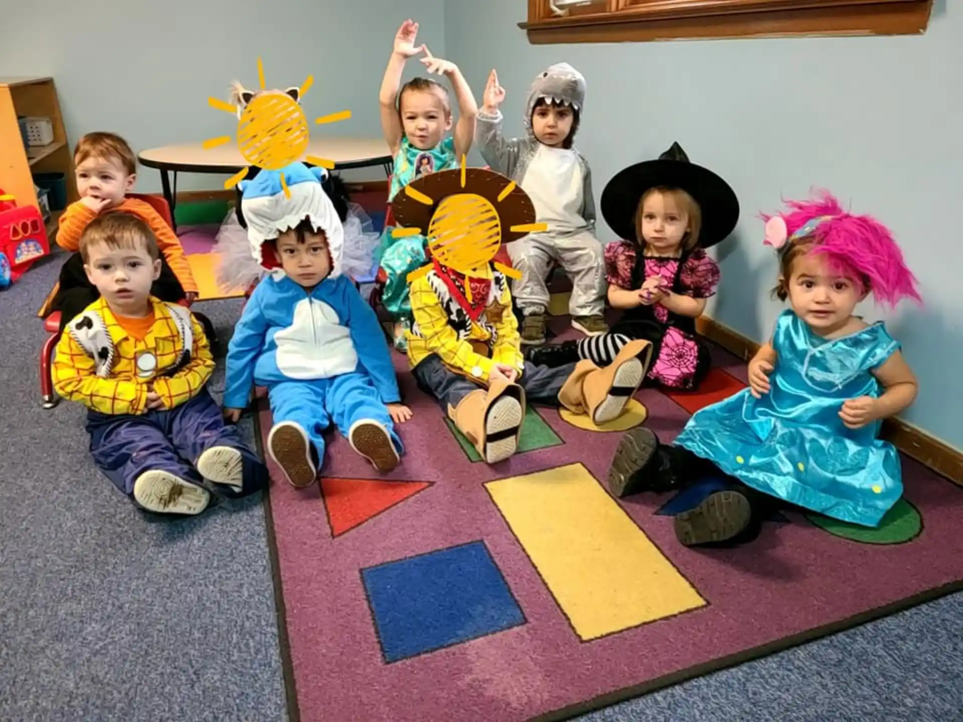 a group of children sitting on the floor