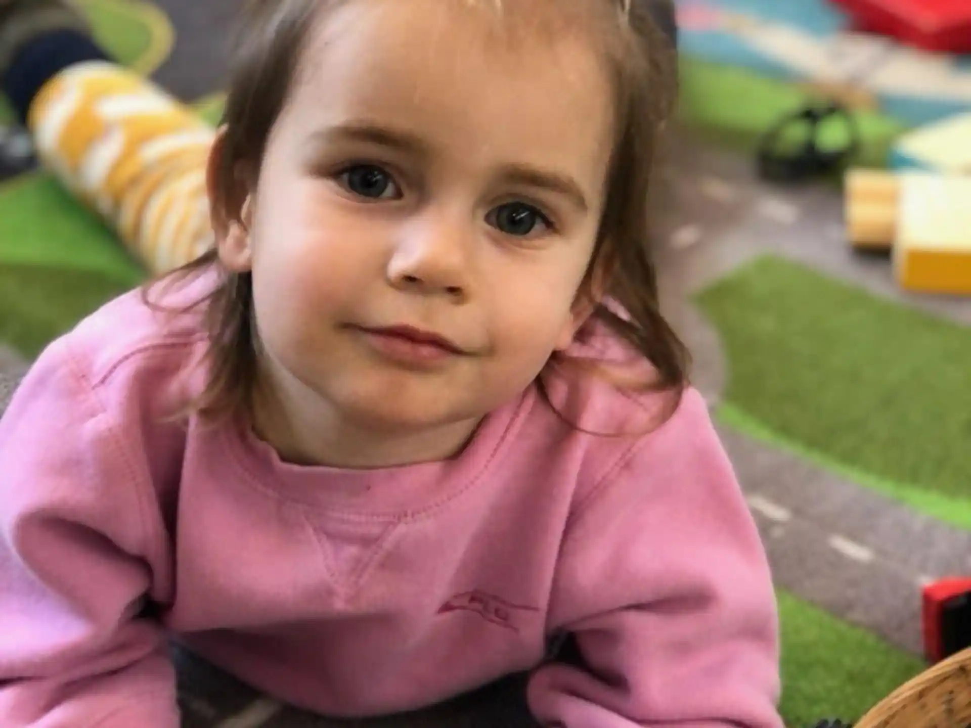 a girl sitting on a bench