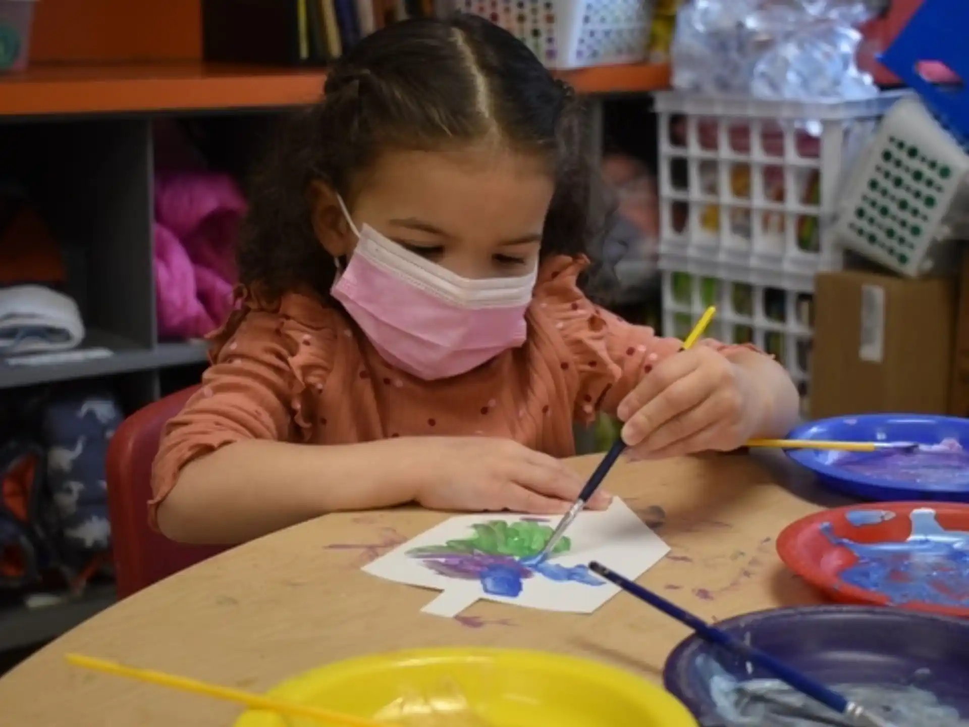 a young girl painting
