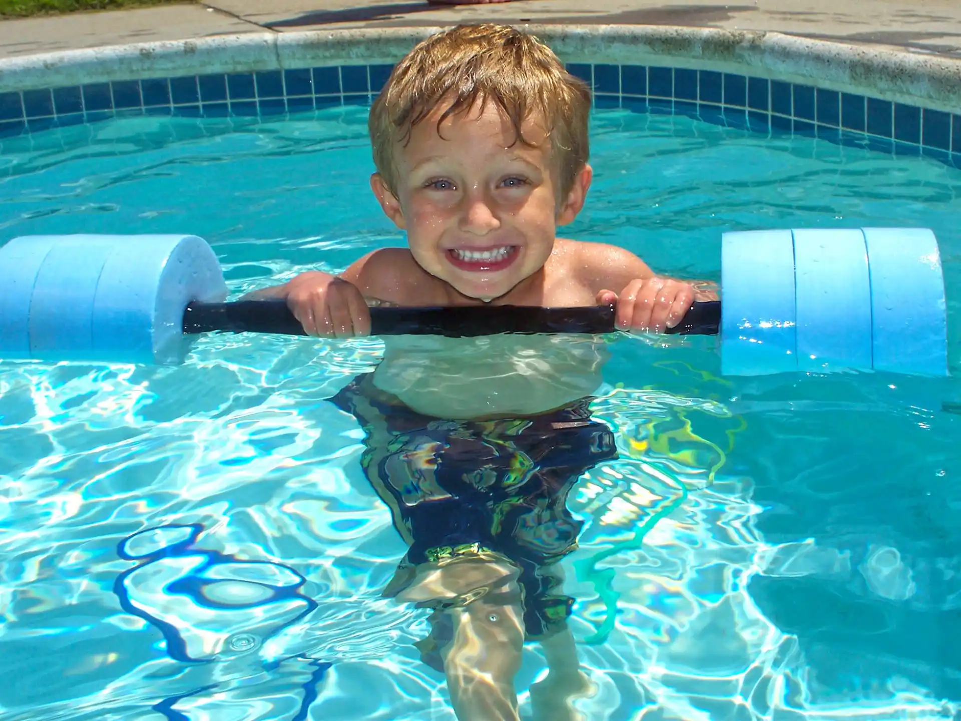 a boy in a pool