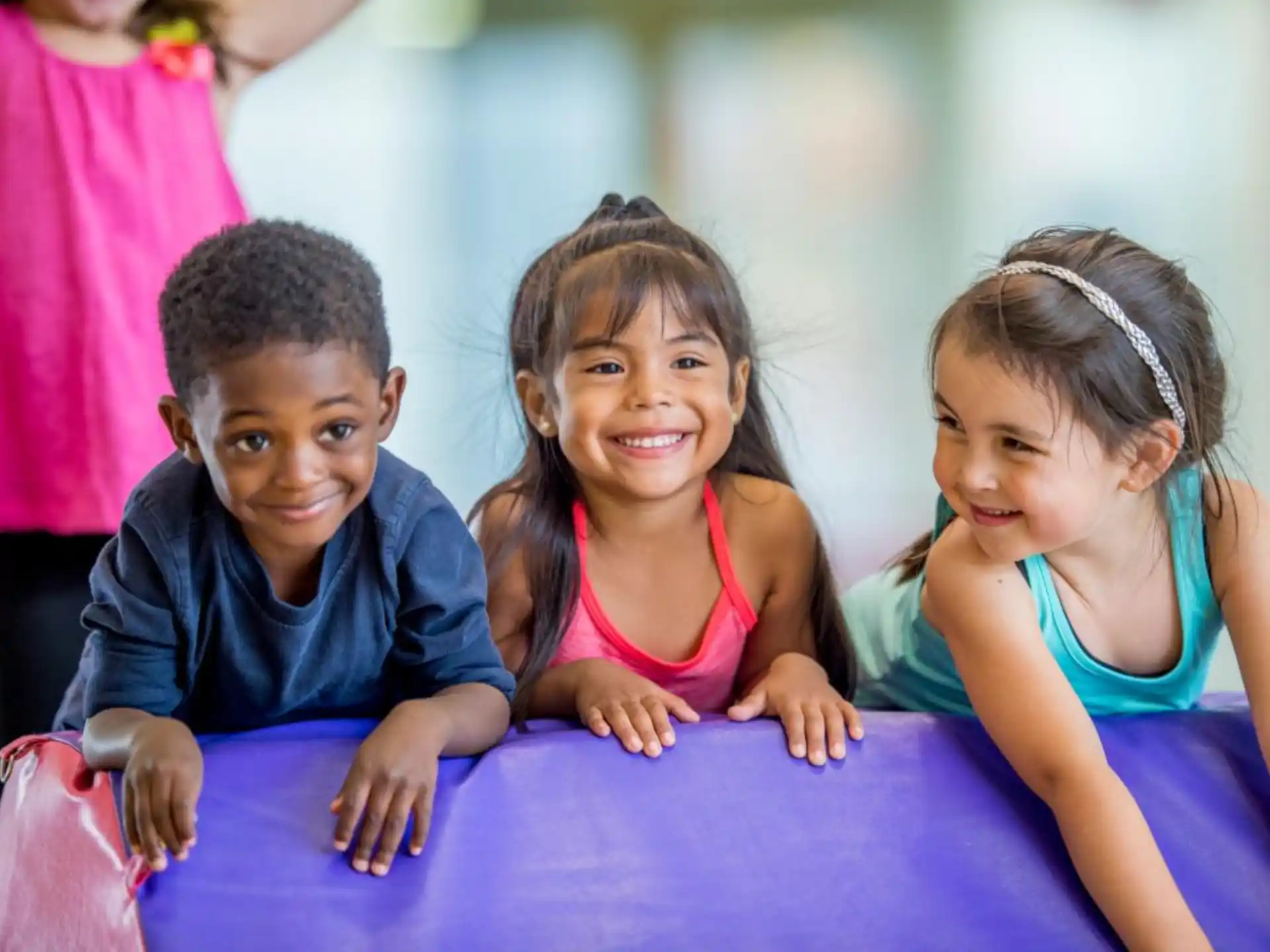 a group of children sitting on the floor
