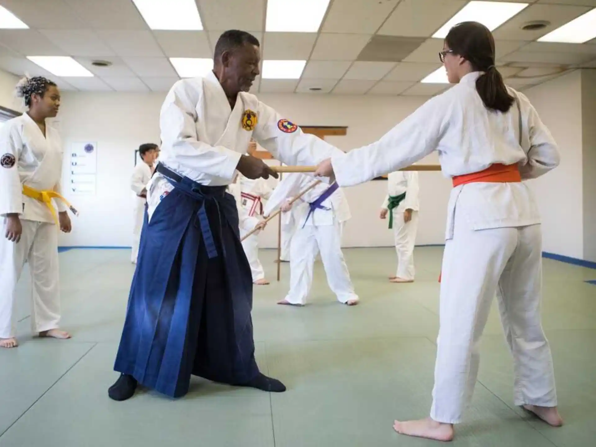 a group of people in karate uniforms
