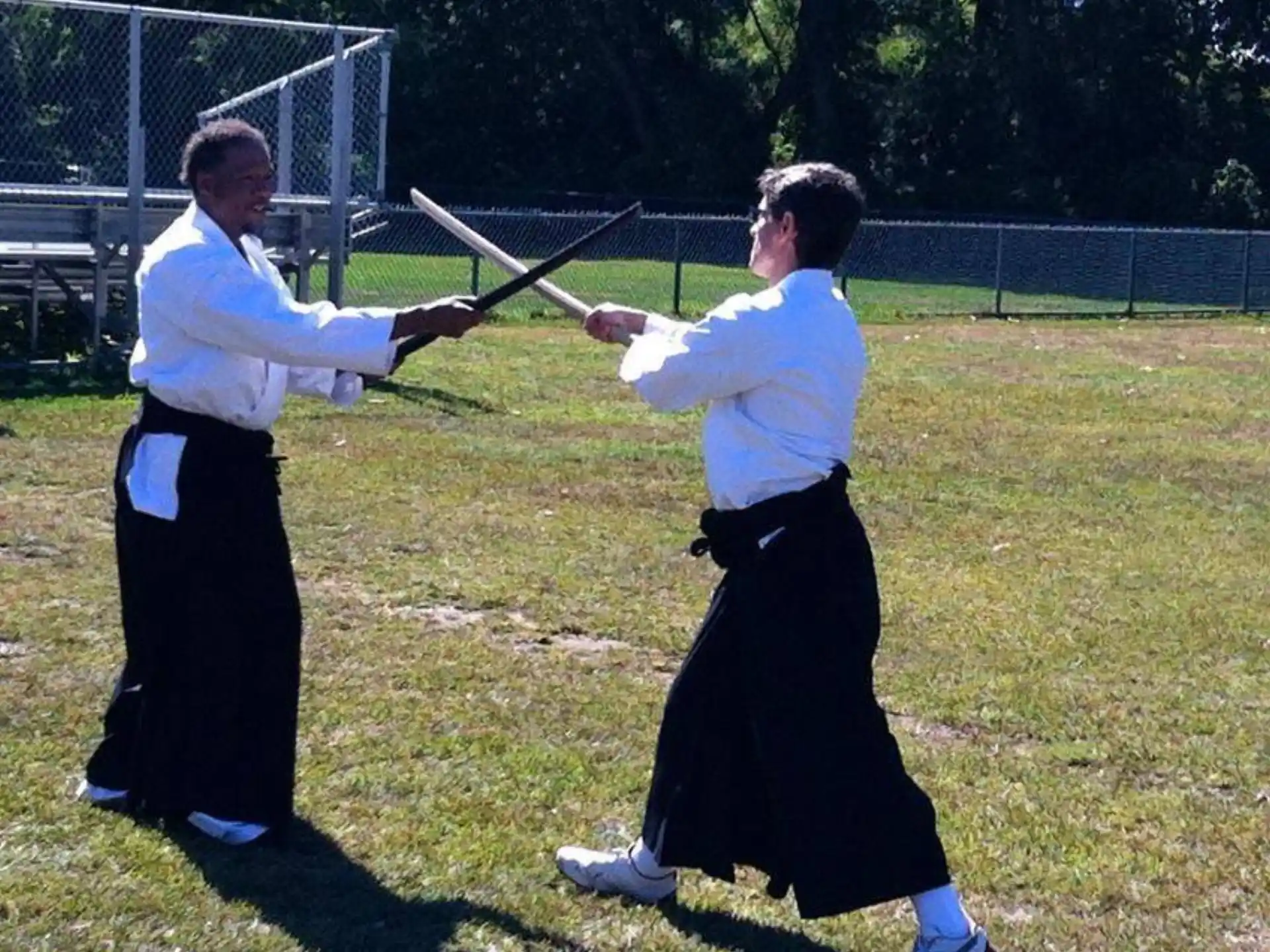a man and a woman playing baseball