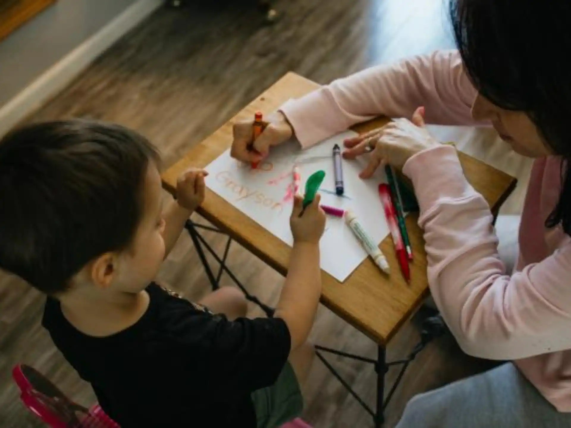 a person and a child painting