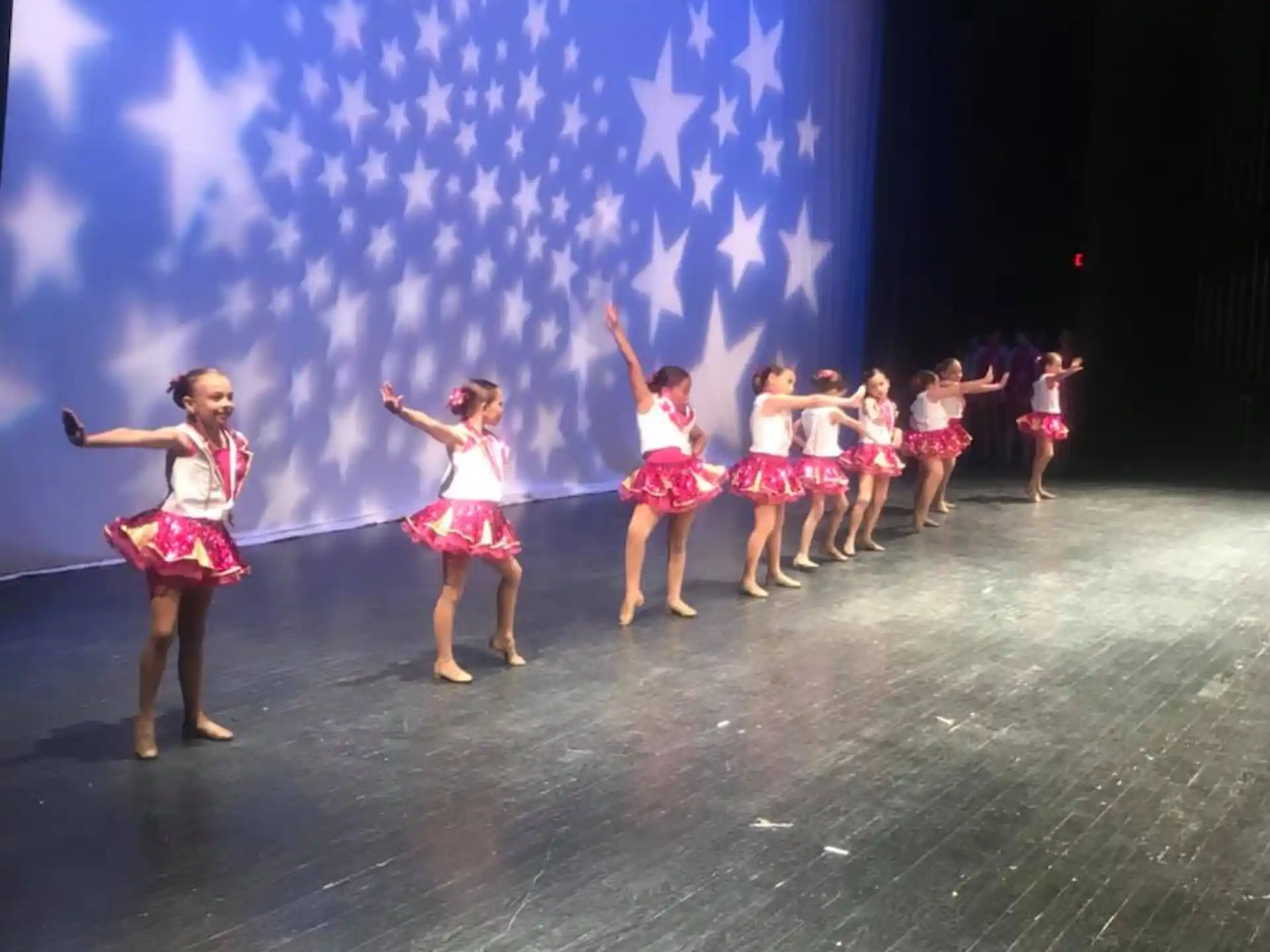 a group of women dancing on a stage