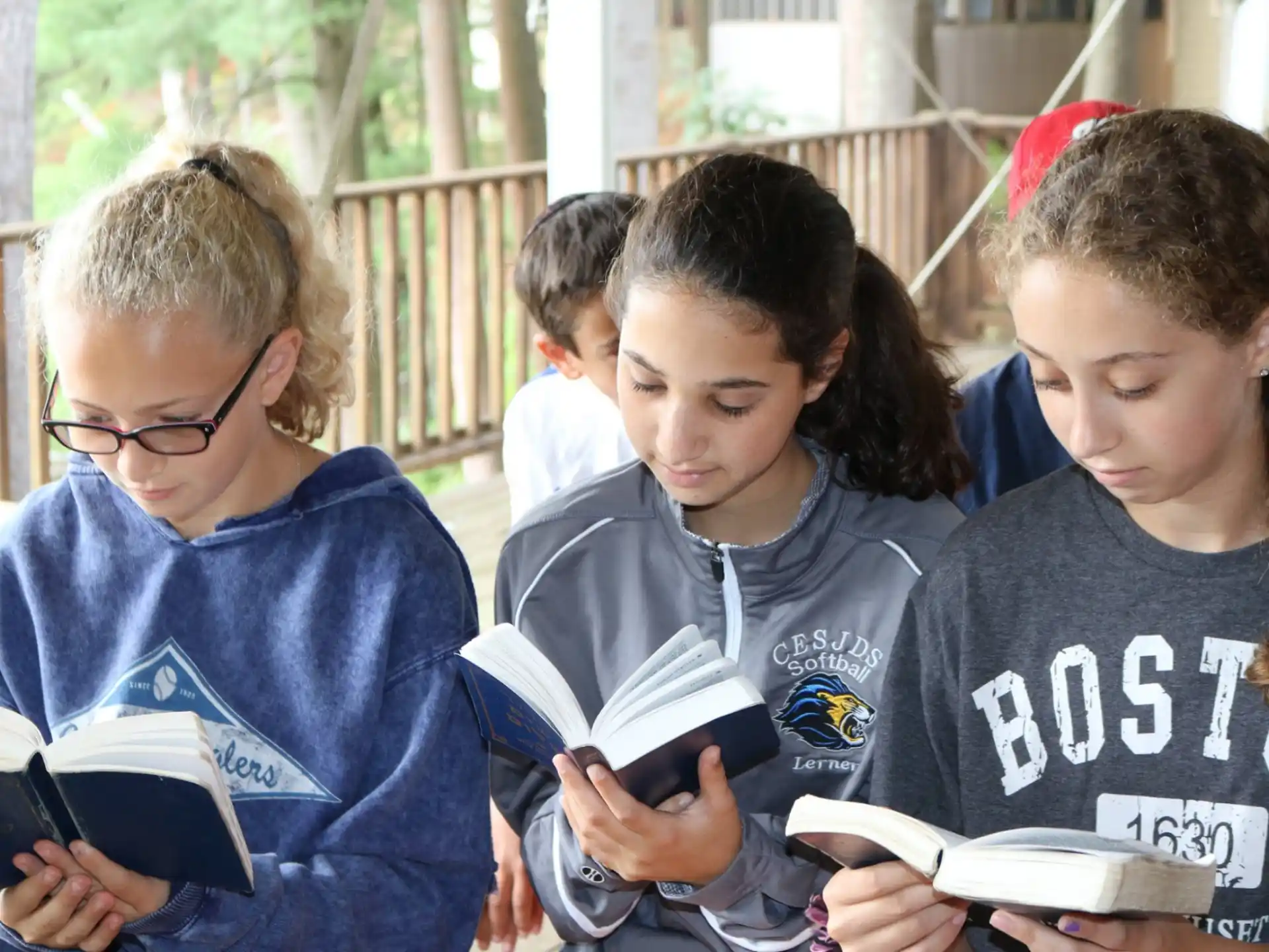 a group of children looking at a book