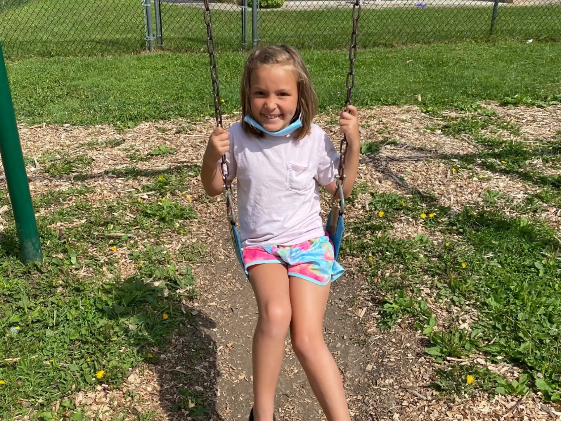 a girl holding a blue rope