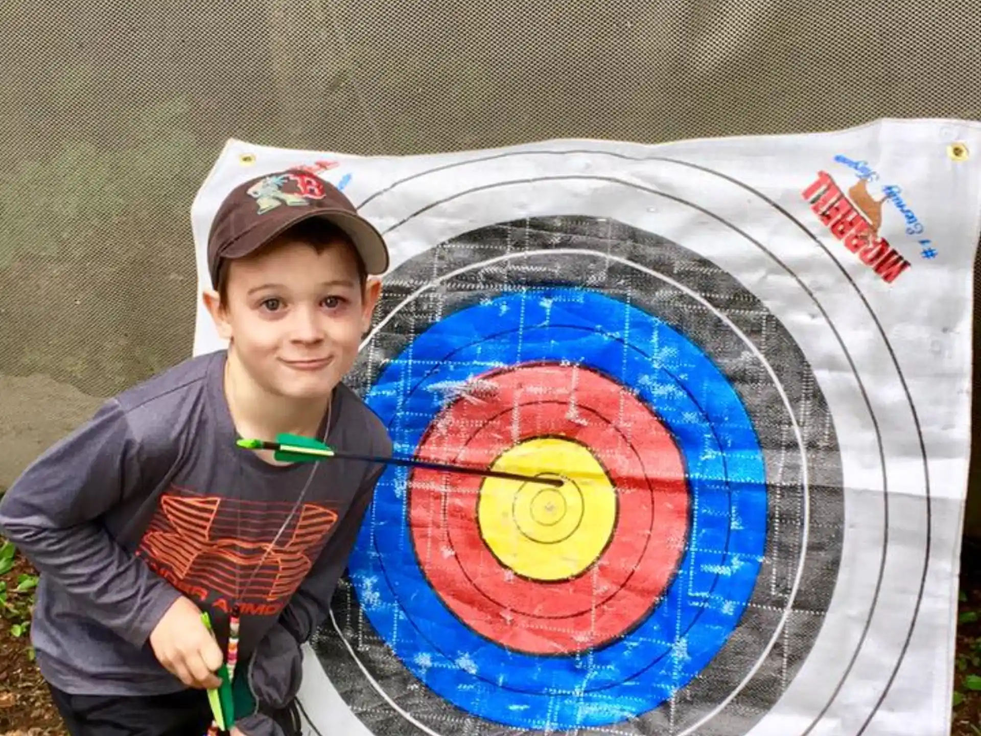 a boy holding a target