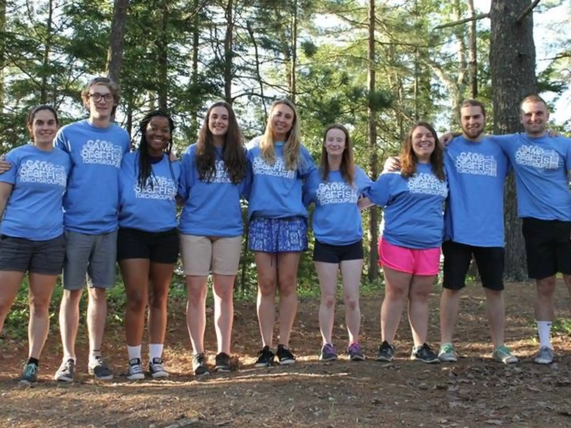 a group of people posing for a photo