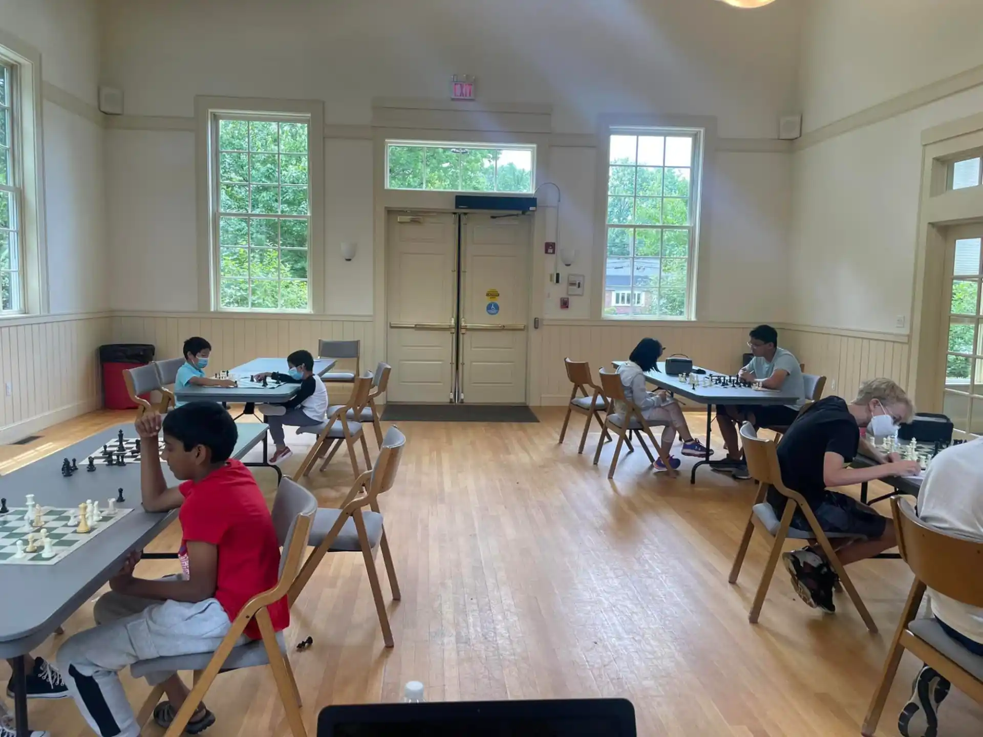 a group of people sitting at tables