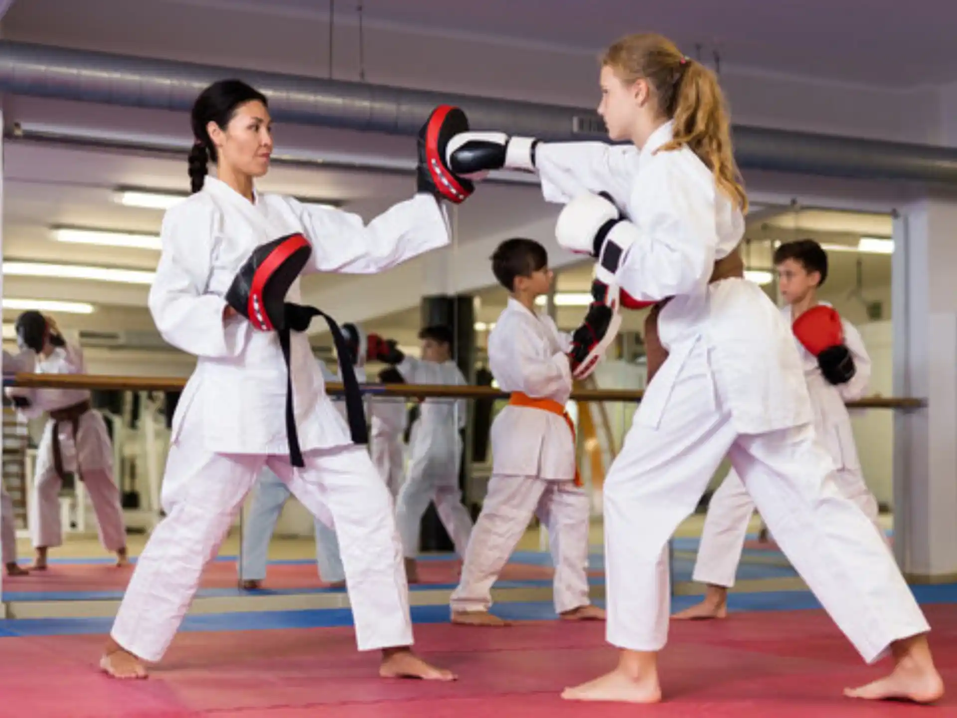 a group of people in karate uniforms
