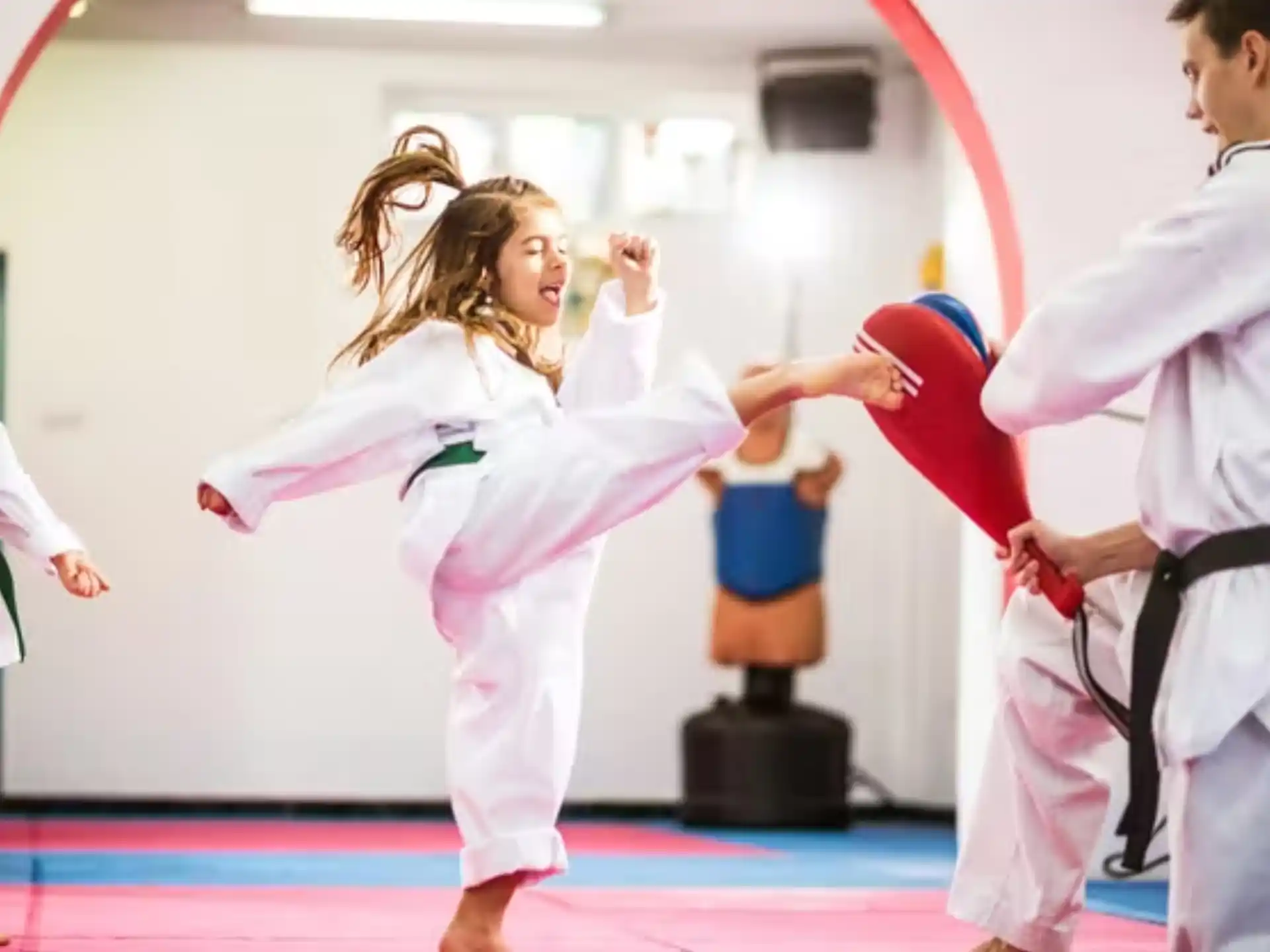 a group of people in karate uniforms