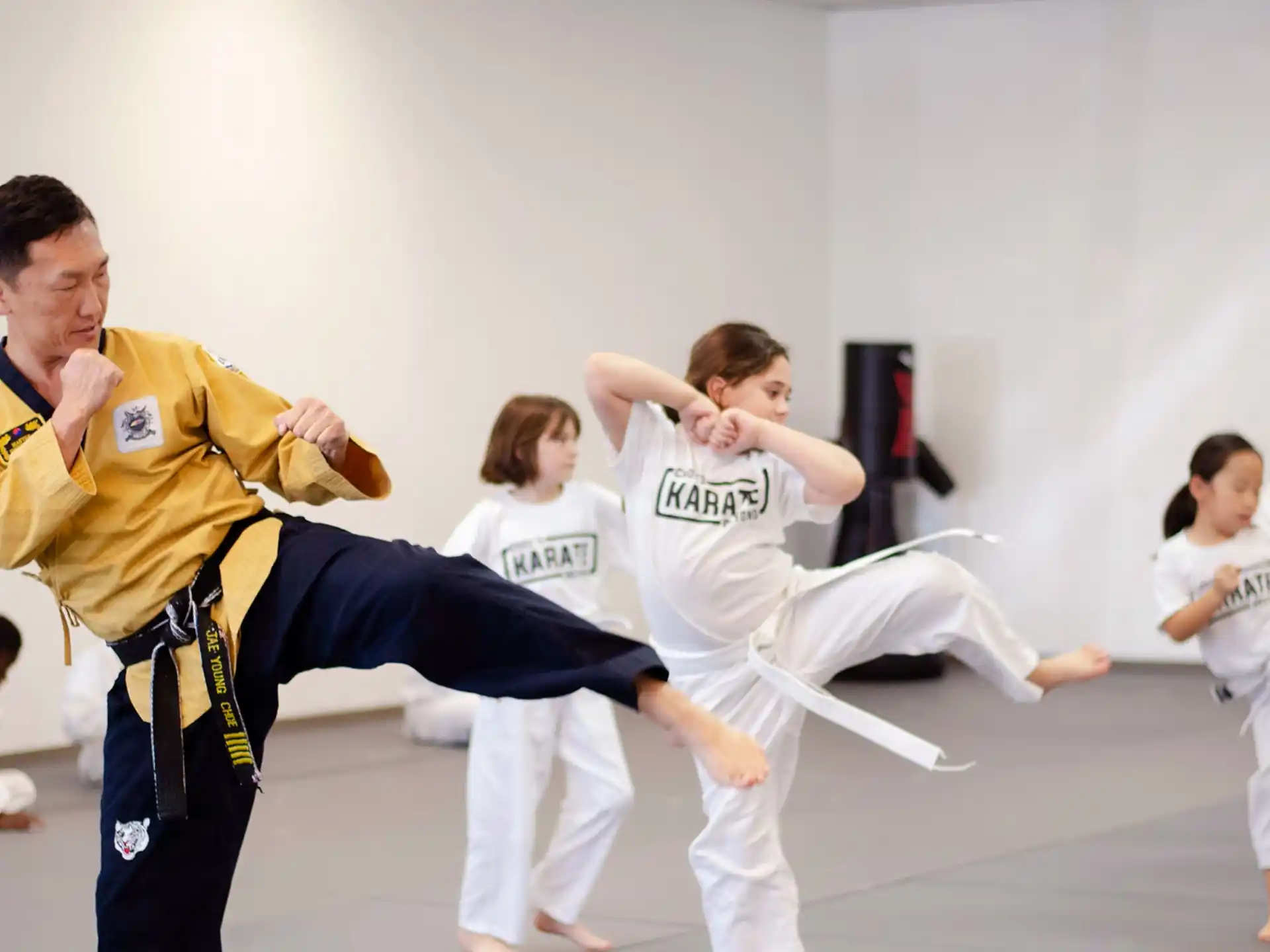 a group of people in karate uniforms