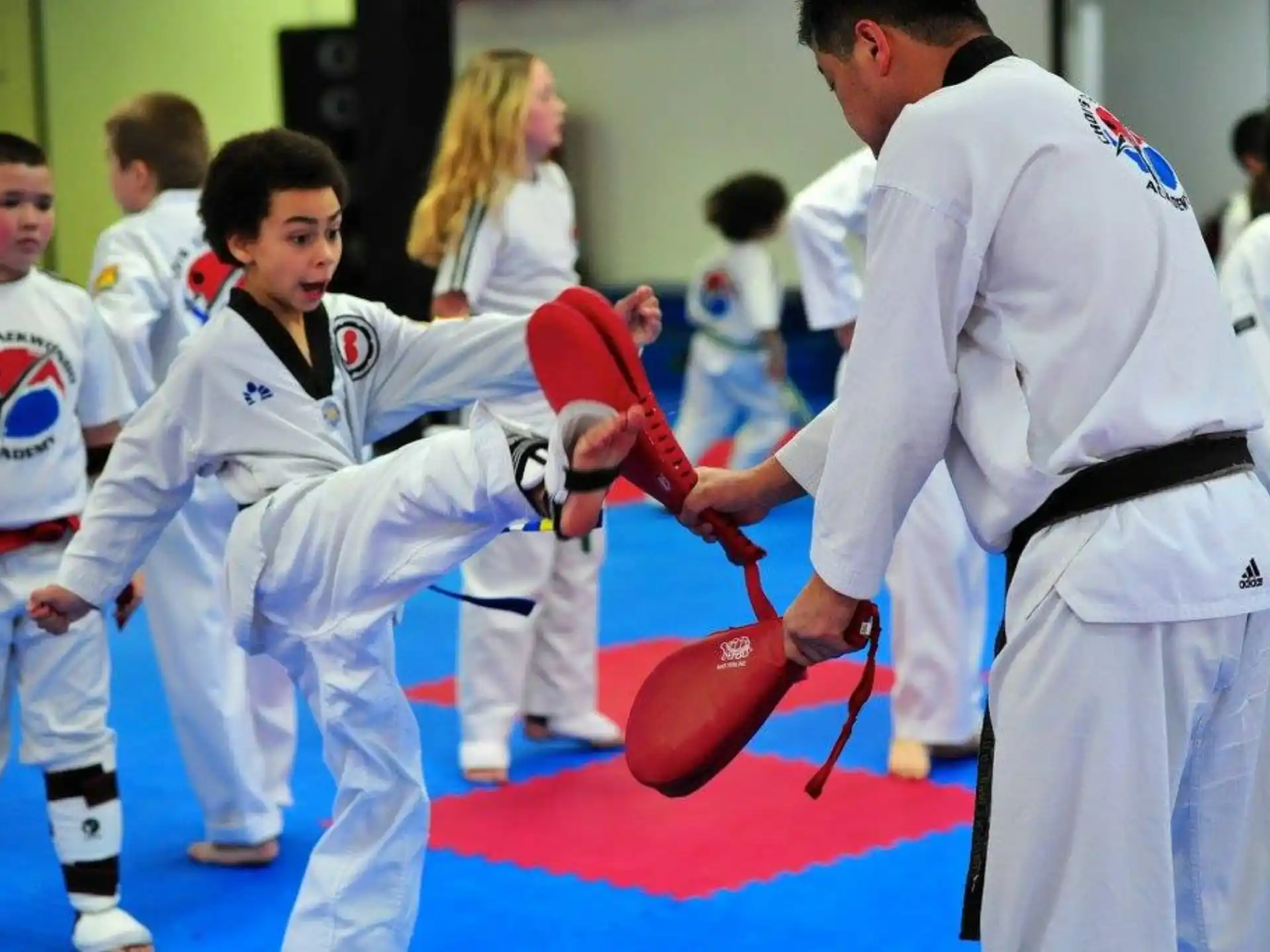a group of people in karate uniforms