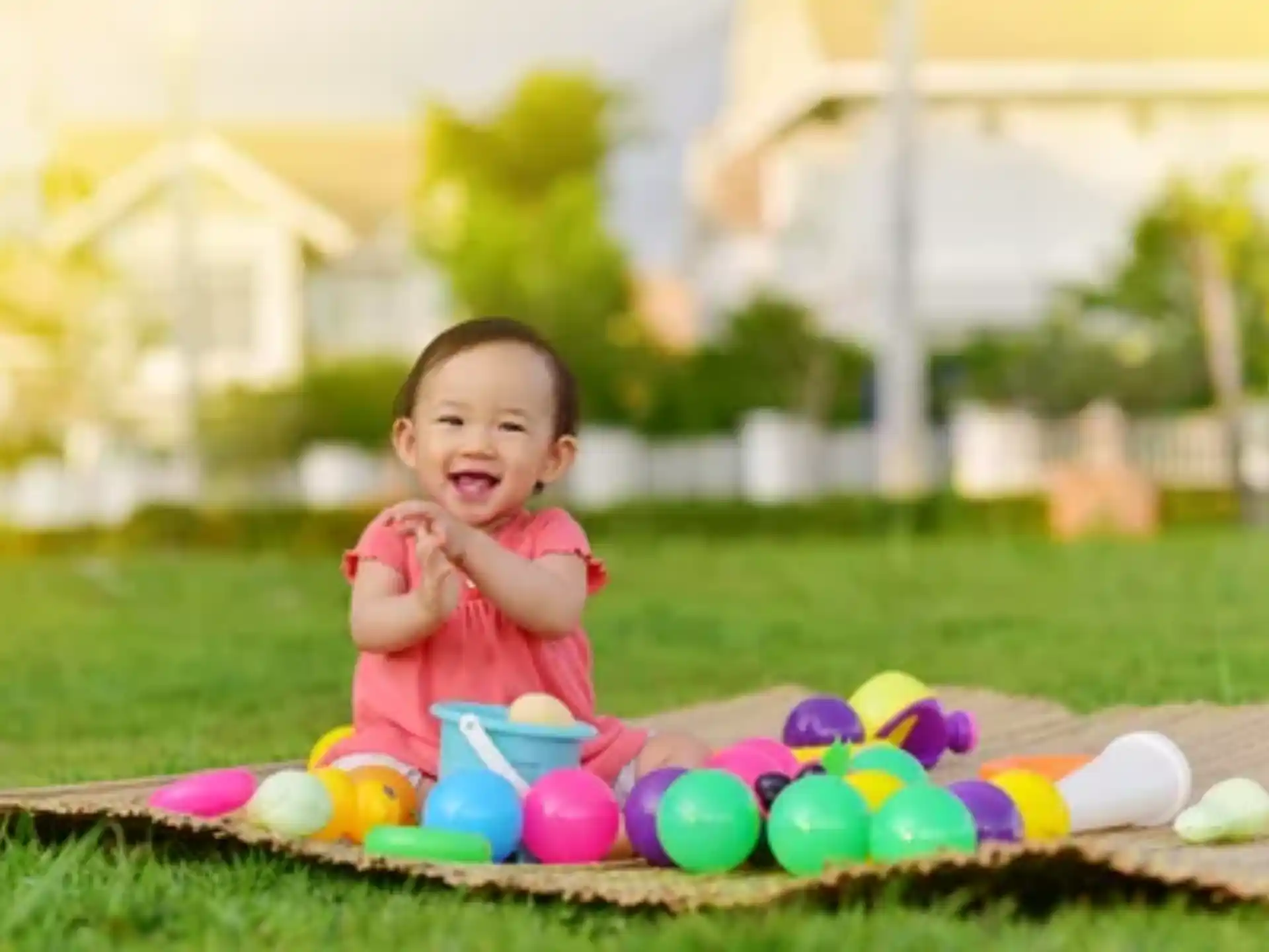 a baby sitting on the grass
