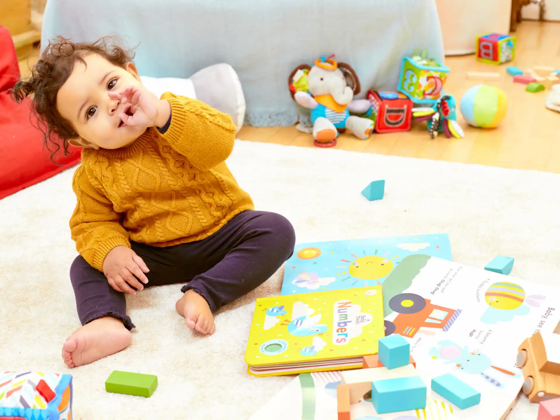 a baby sitting on the floor