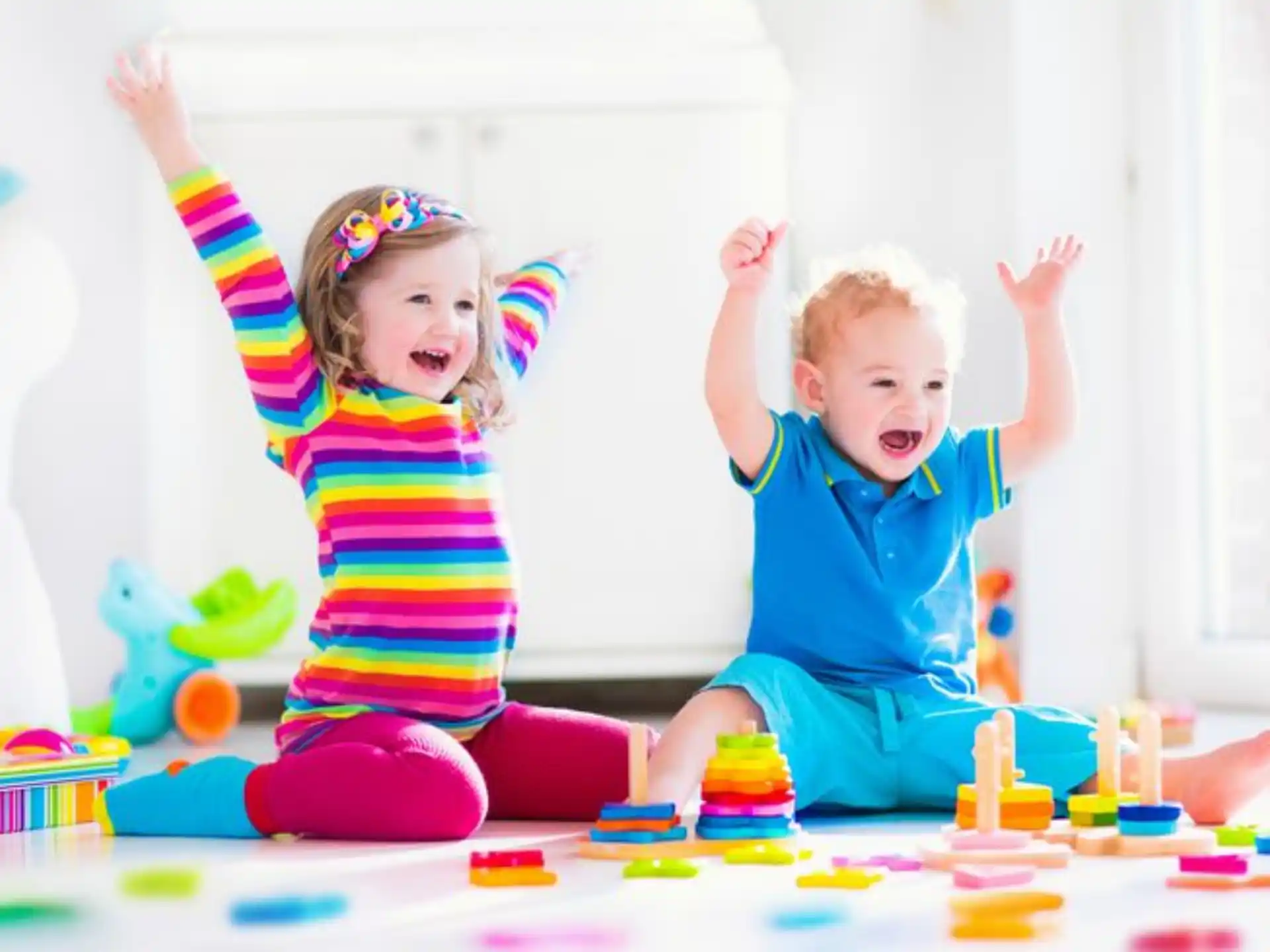 a couple of children playing with toys