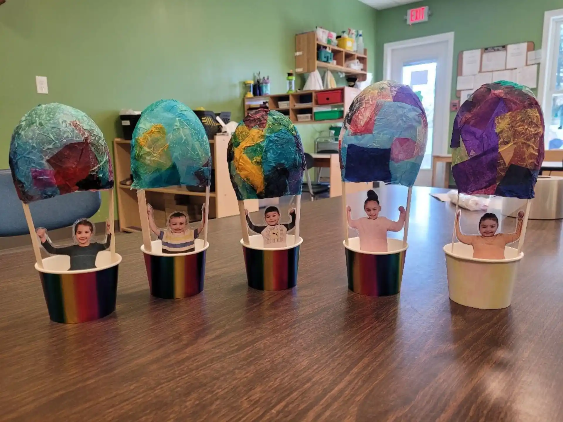 a group of people in a room with large balls