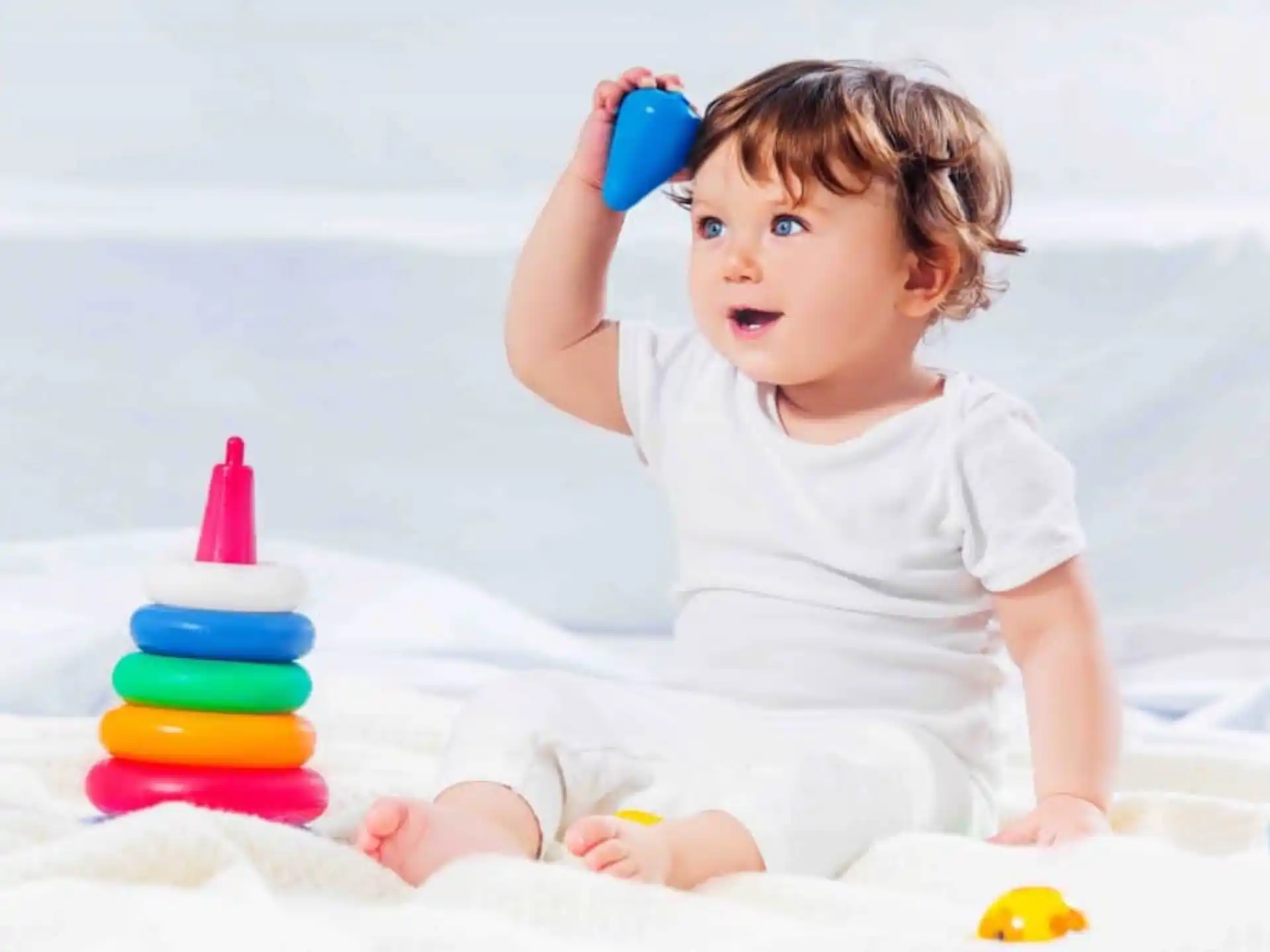 a baby playing with toys