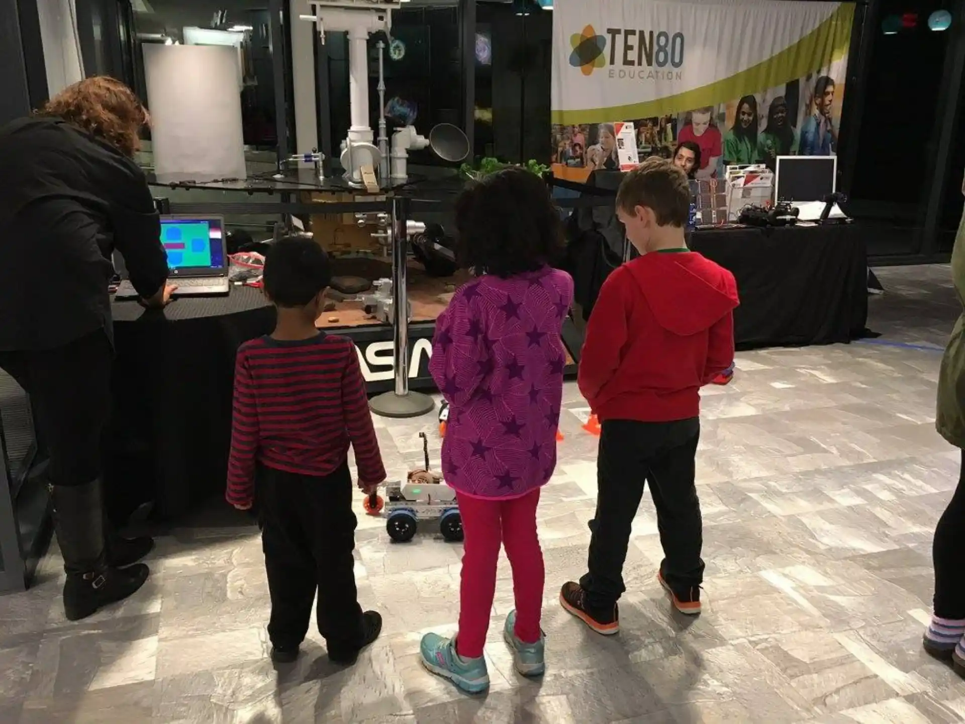 a group of children playing with toys