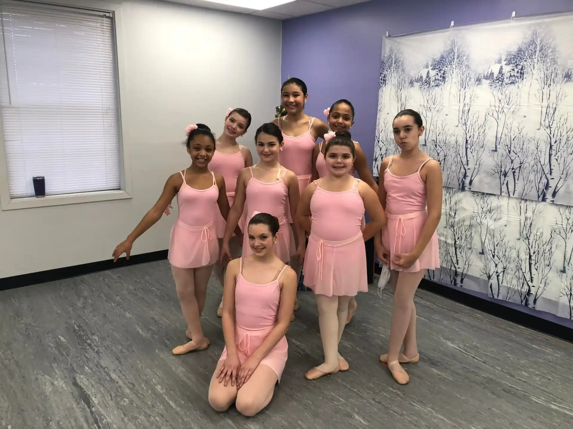 a group of women in pink dresses