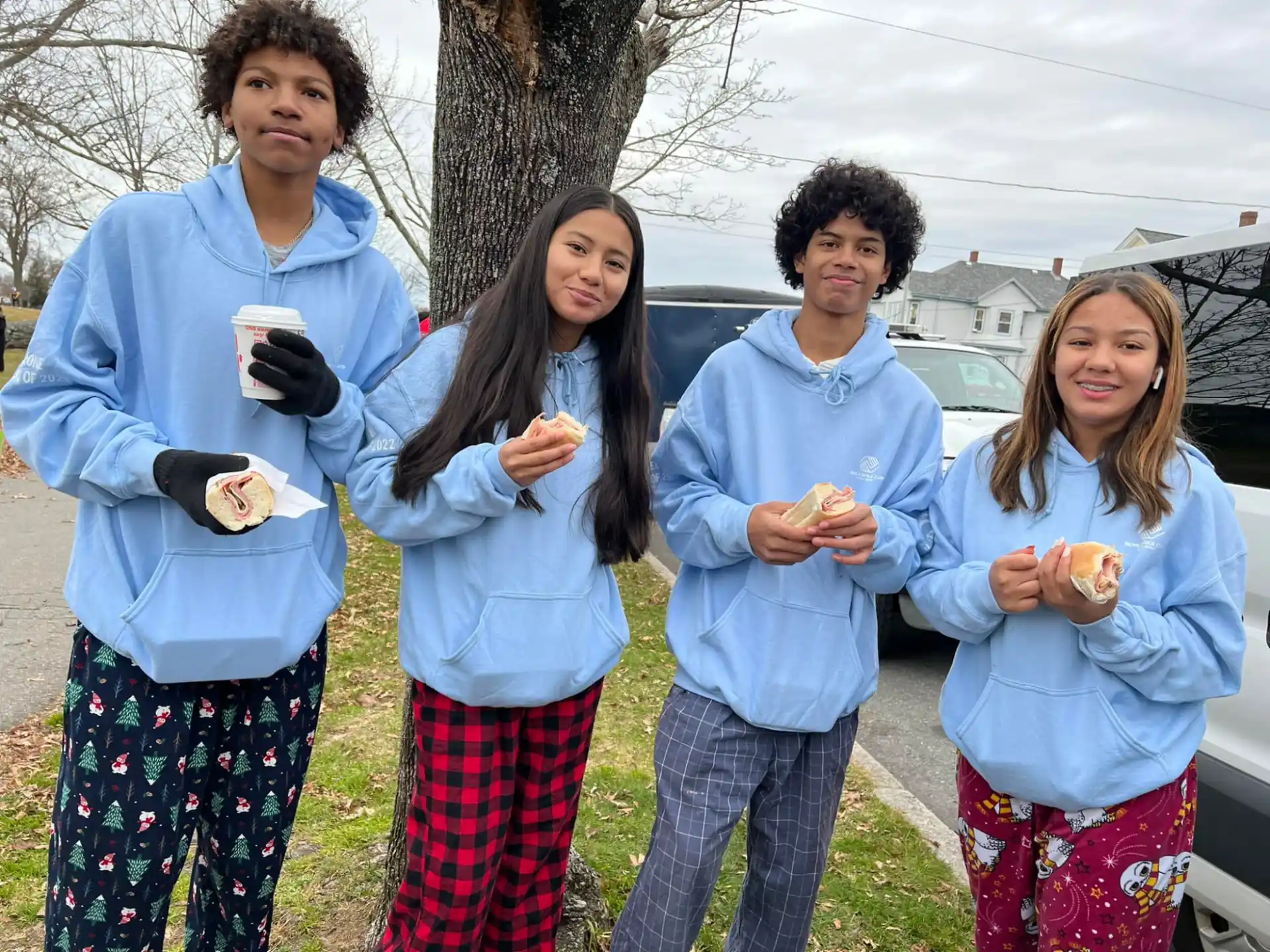 a group of people holding food