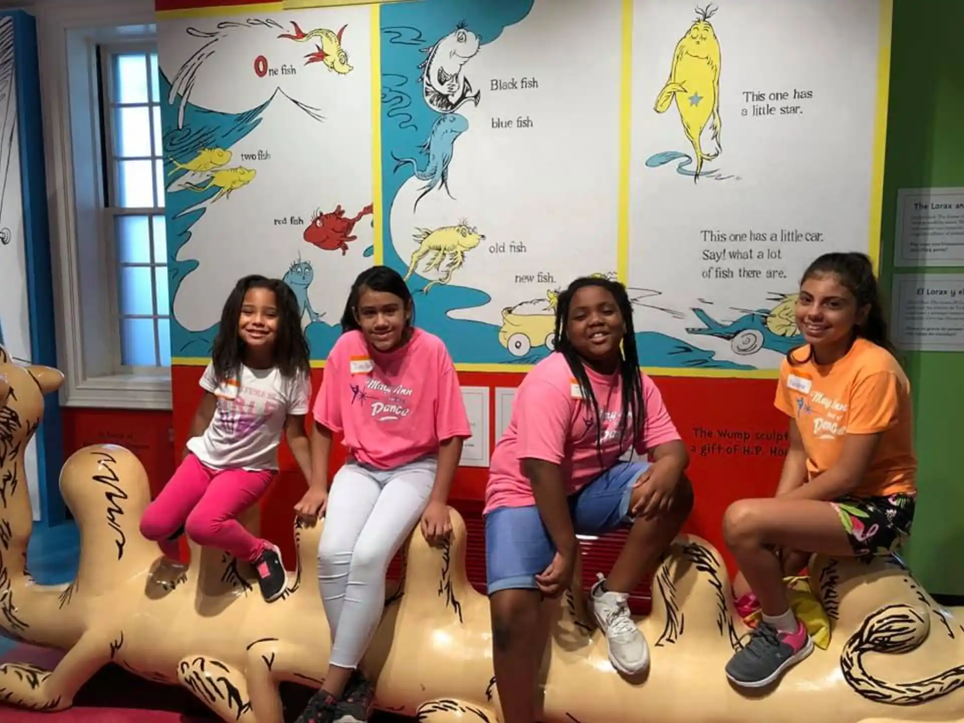 a group of women sitting on the floor