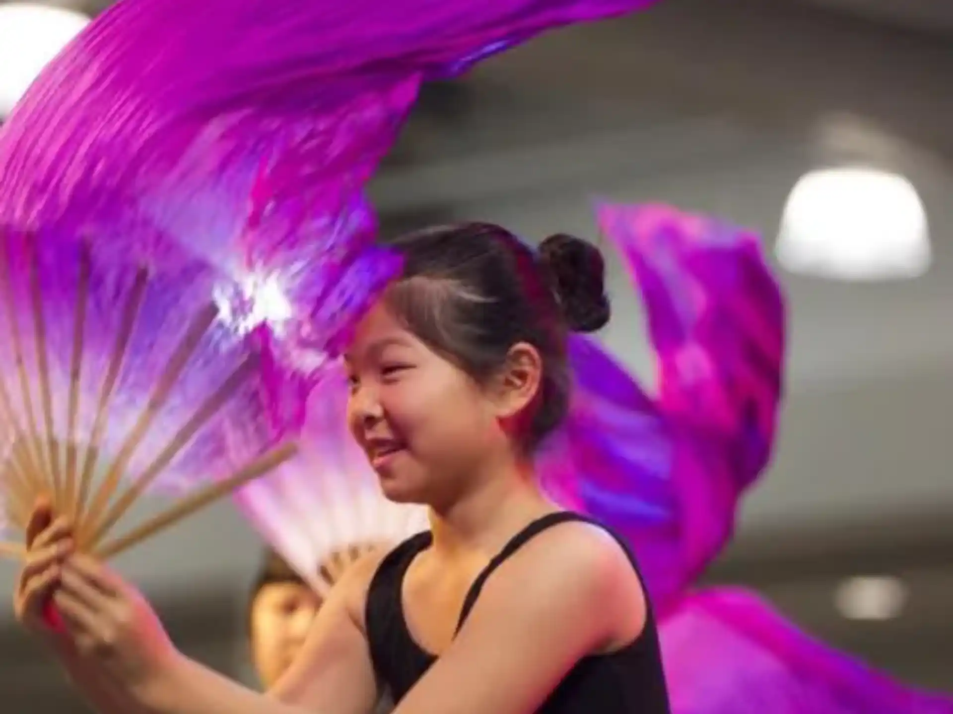 a woman holding a purple umbrella