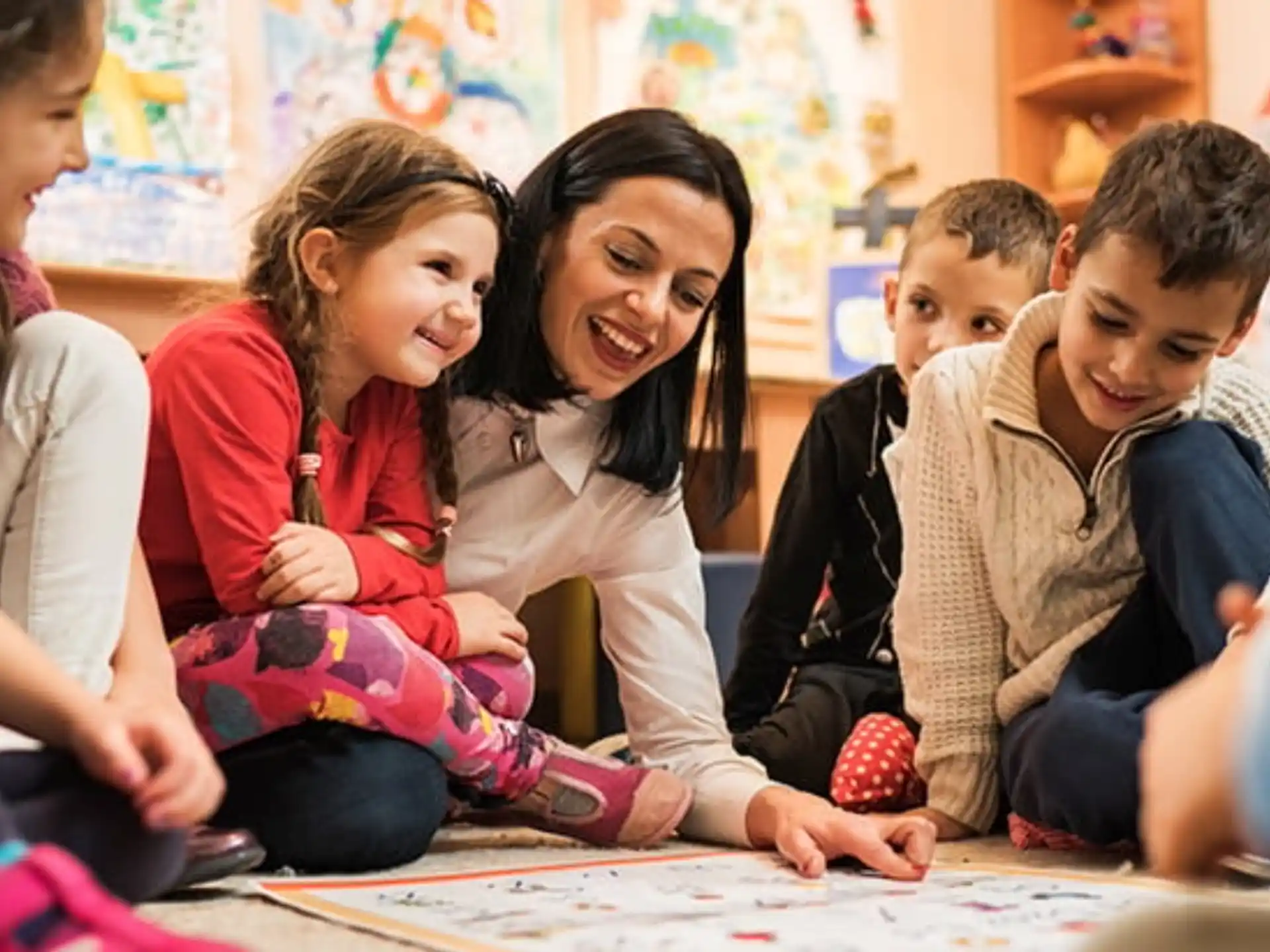 a group of children sitting at a table