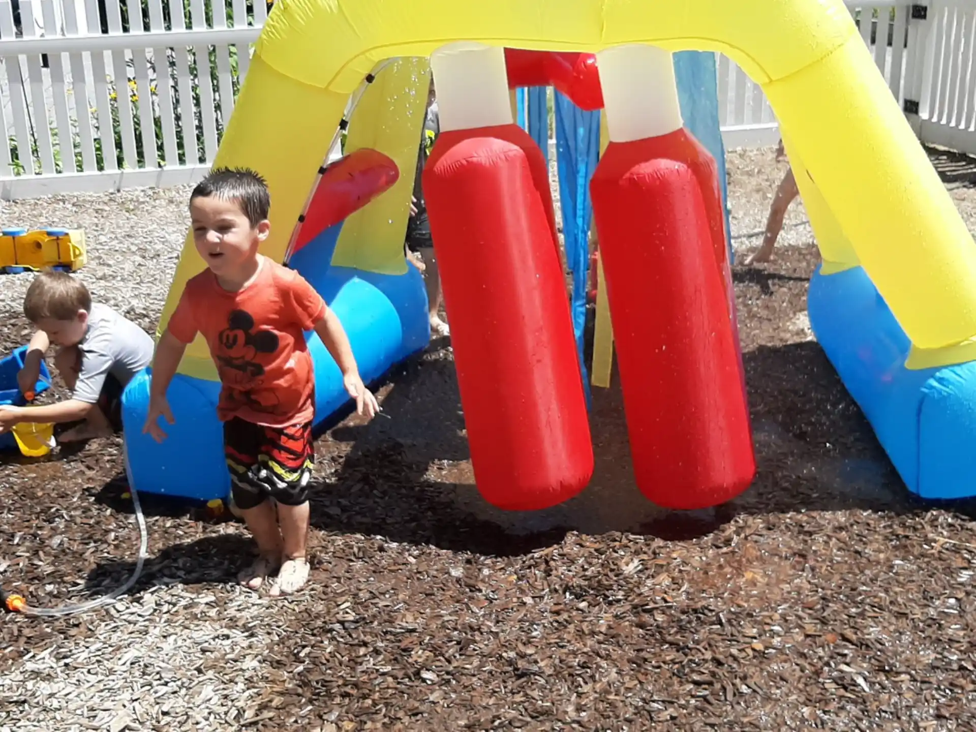 a group of kids playing in a sandbox
