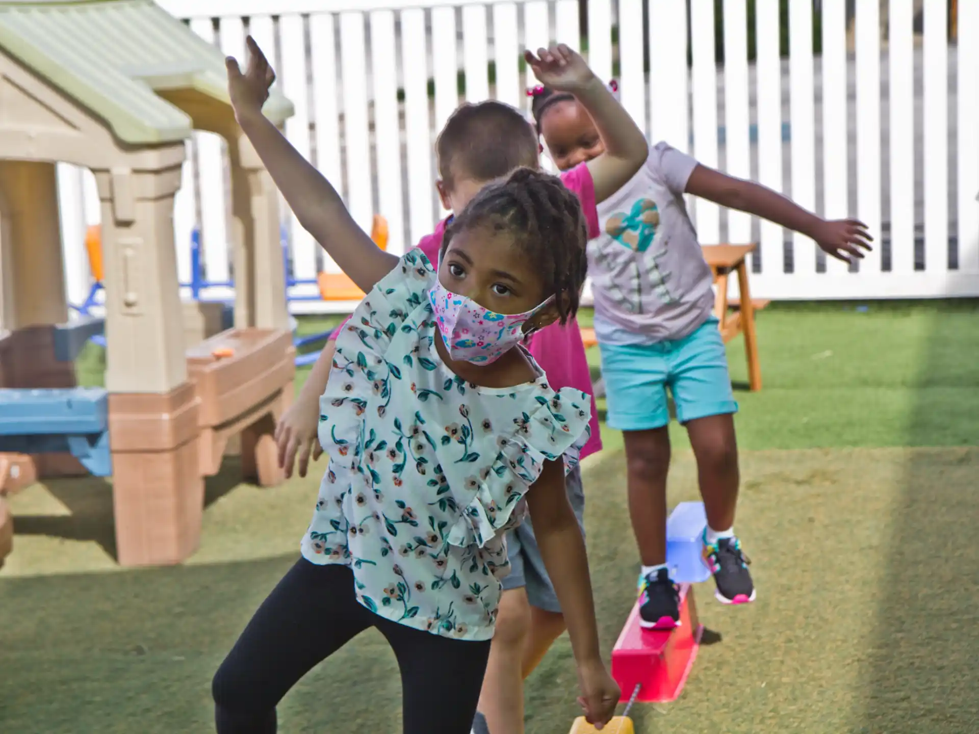 a group of children jumping in the air