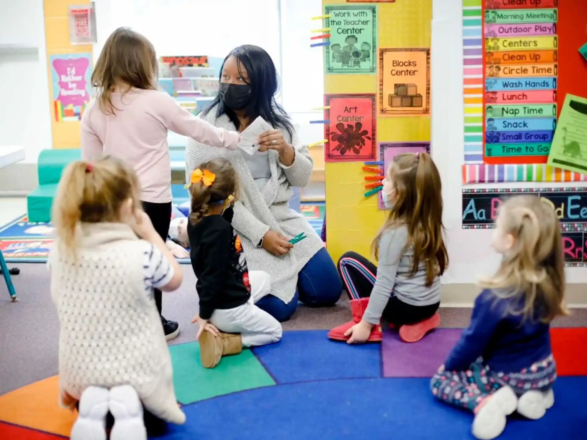 a person teaching children in a classroom